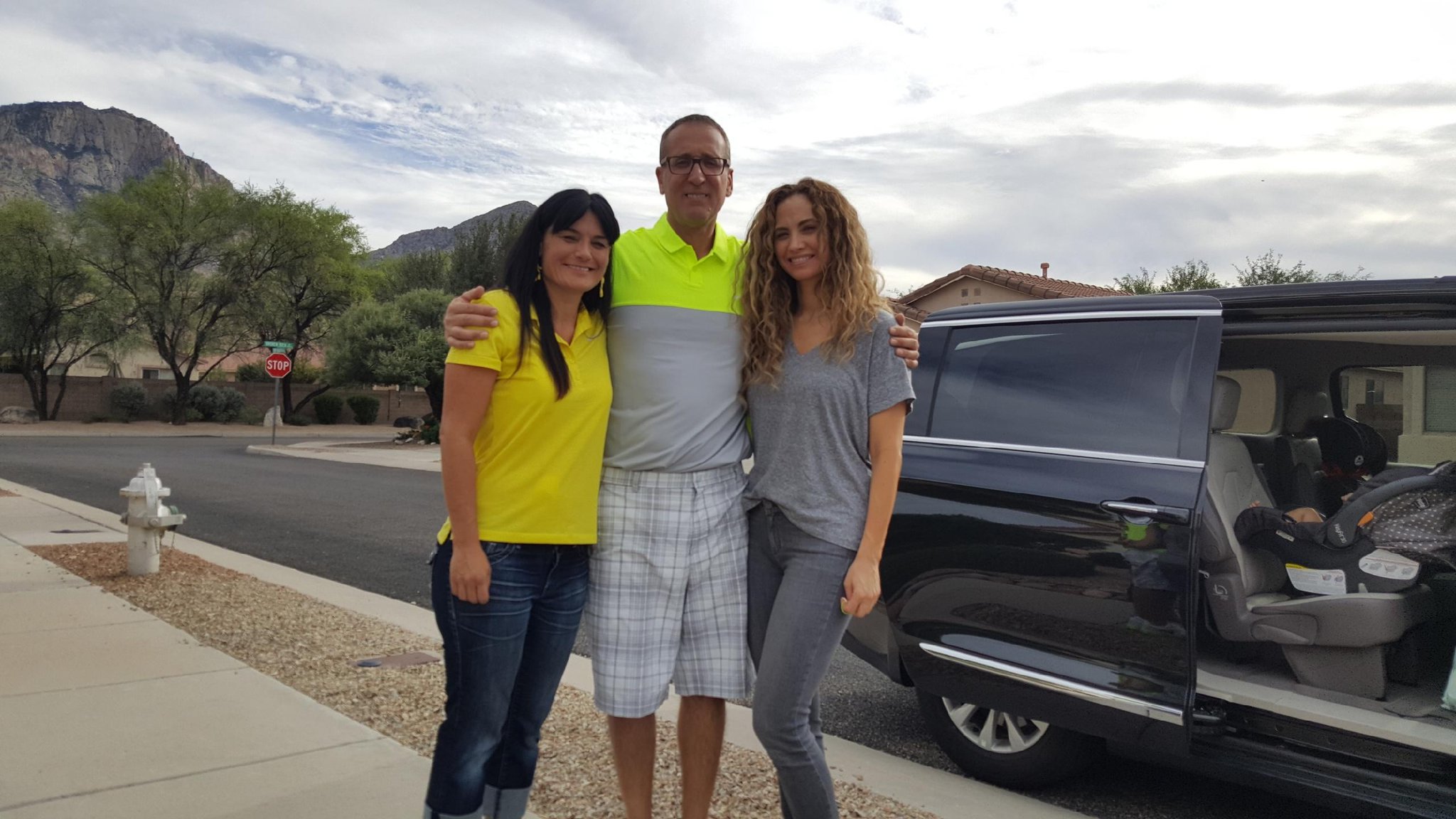 Ron Bell, center, poses with his girlfriend, Jennifer Pendley, at left, and Kerri Pastner, the wife of Georgia Tech basketball coach Josh Pastner, outside the home Bell shares with Pendley in Tucson, Arizona. Kerri Pastner visited Bell and Pendley with her three daughters.