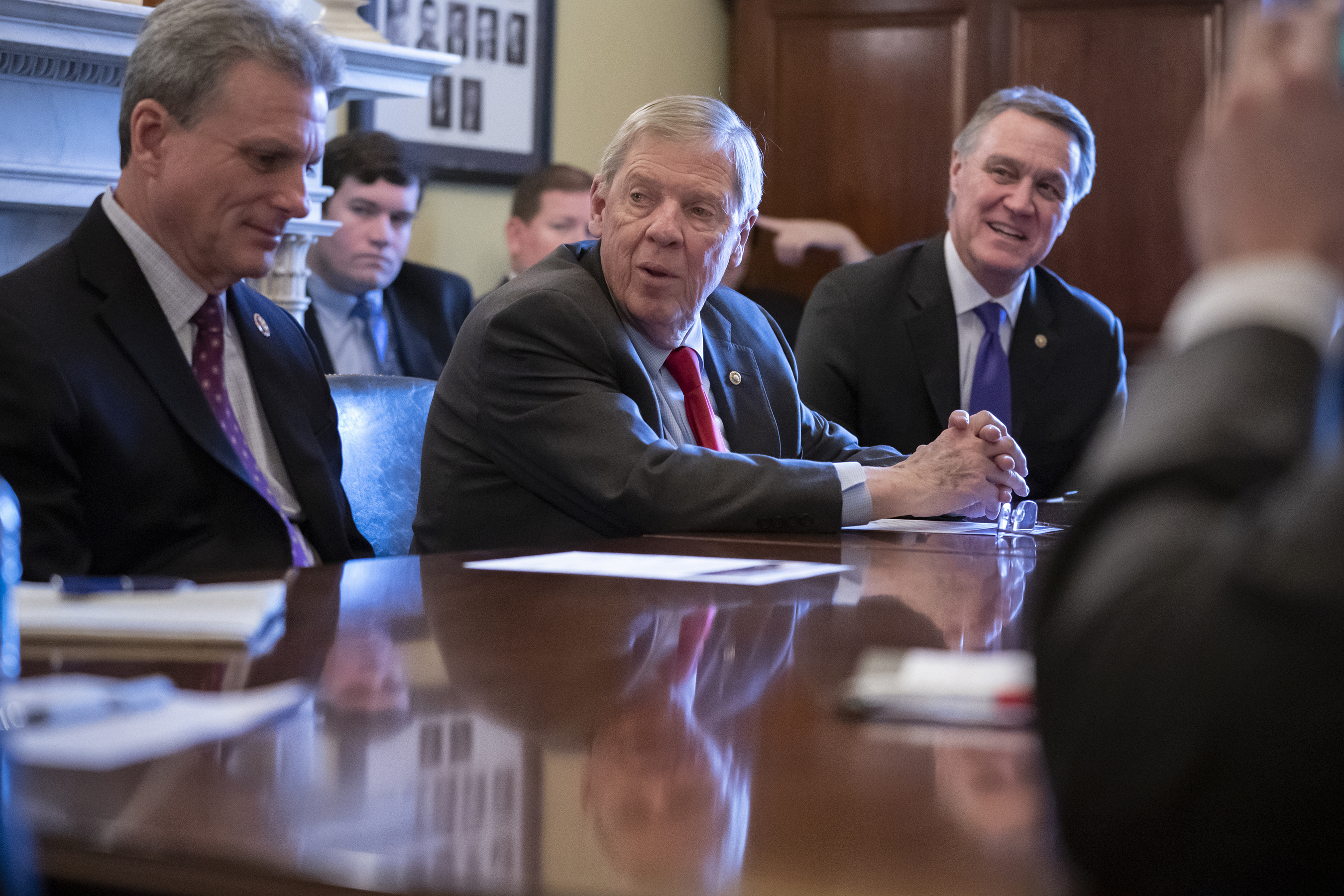 Sen. Johnny Isakson, R-Ga., flanked by Rep. Buddy Carter R-Ga., left, and Sen. David Perdue, R-Ga., right, leads a meeting with the Georgia Ports Authority and the Army Corps of Engineers to request full funding for the Savannah Harbor Expansion Project in the 2020 federal budget, on Capitol Hill in Washington, Thursday, Feb. 14, 2019. (AP Photo/J. Scott Applewhite)