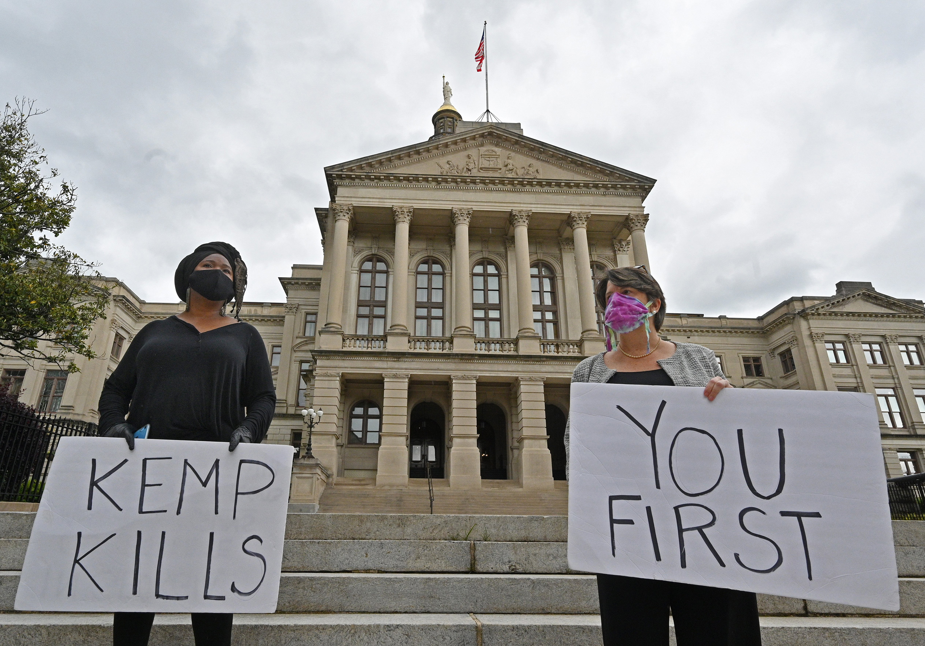 Activists demonstrate outside the Capitol in April 2020 to illustrate what they believed would be the deadly consequences of Kemp's decision to lift some pandemic restrictions after just 22 days.
(Hyosub Shin / Hyosub.Shin@ajc.com)