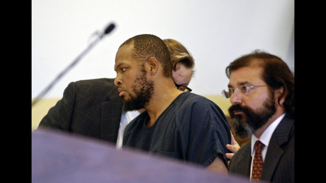 Siraj Ibn Wahhaj, center, confers with one of his attorneys at a first appearance in New Mexico district court in Taos, N.M., on Wednesday, Aug. 8, 2018, on accusations of child abuse and abducting his son from the boy's mother. (AP Photo/Morgan Lee) </p>
