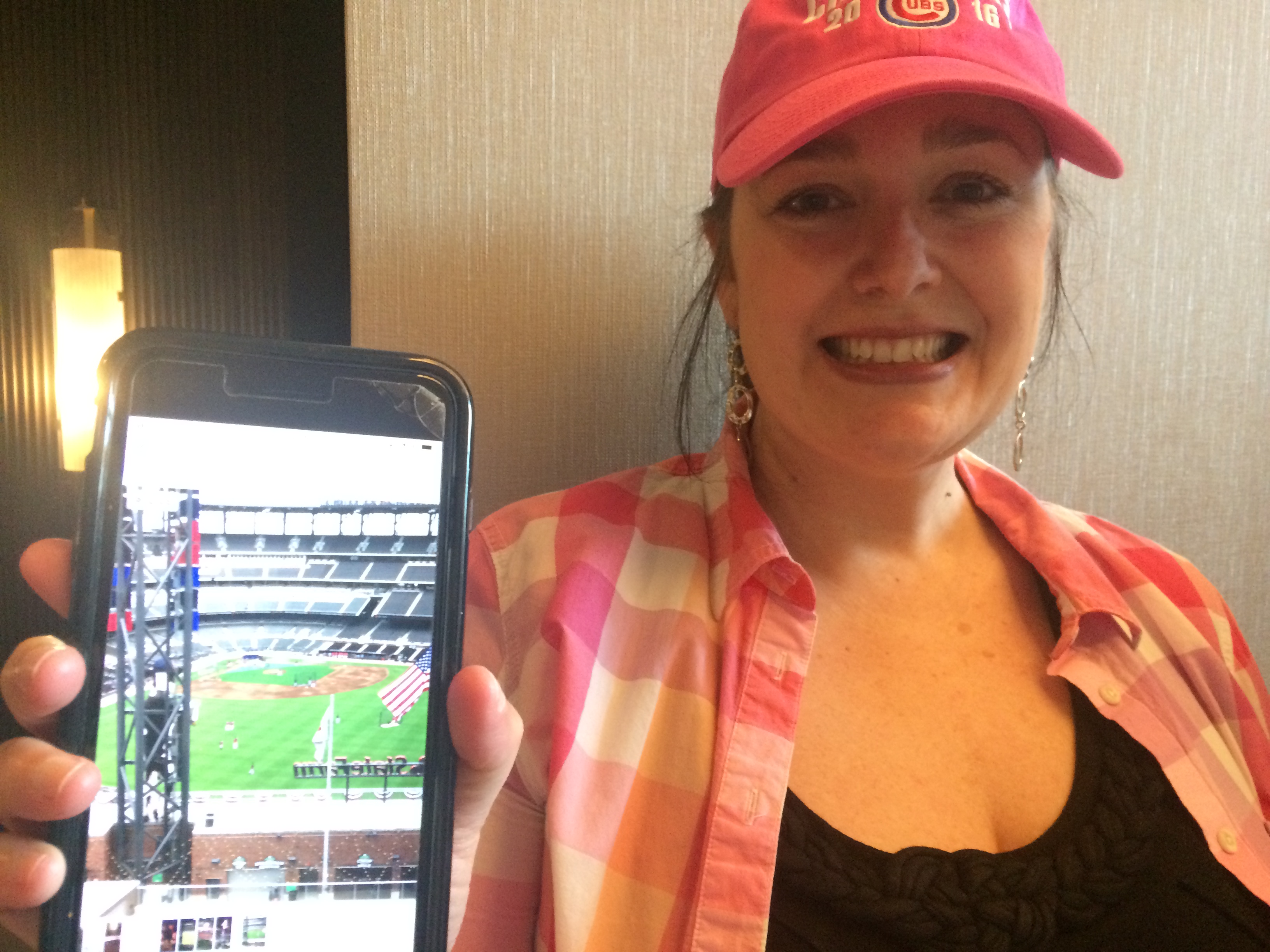 On her way to SunTrust Park to take in Thursday's Opening Day Braves game, Cheyenne Brinson paused to show a photo she'd taken of the view through the window of her 11th floor room at the Omni Hotel at the Battery Atlanta. Jill Vejnoska/AJC