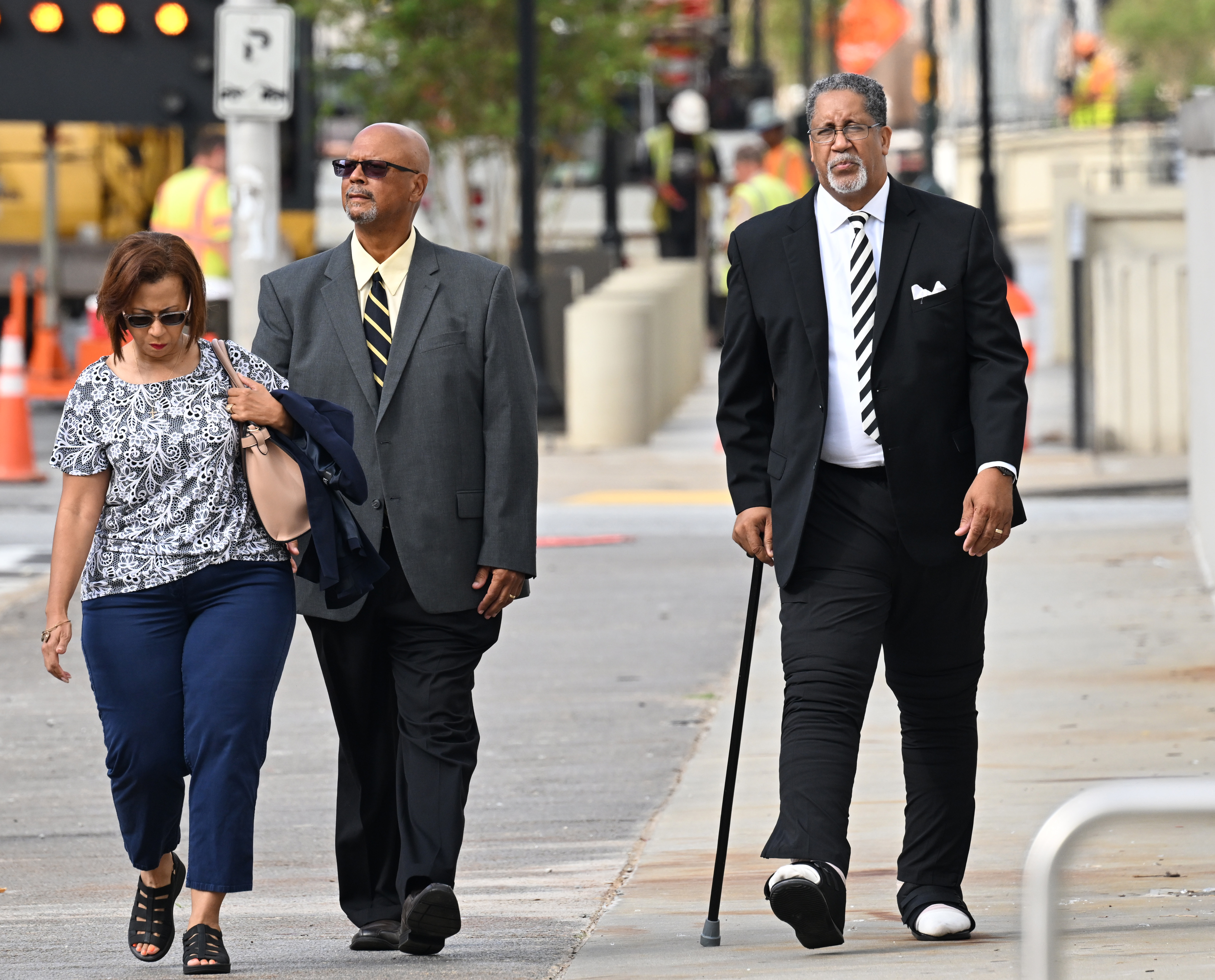 July 13, 2022 Atlanta - Former Stonecrest Mayor Jason Lary (right) arrives at the Richard B. Russell Federal Building for his sentencing hearing in a federal fraud case related to the misuse of relief funds City's COVID on Wednesday, July 13, 2022. (Hyosub Shin / Hyosub.Shin@ajc.com)
