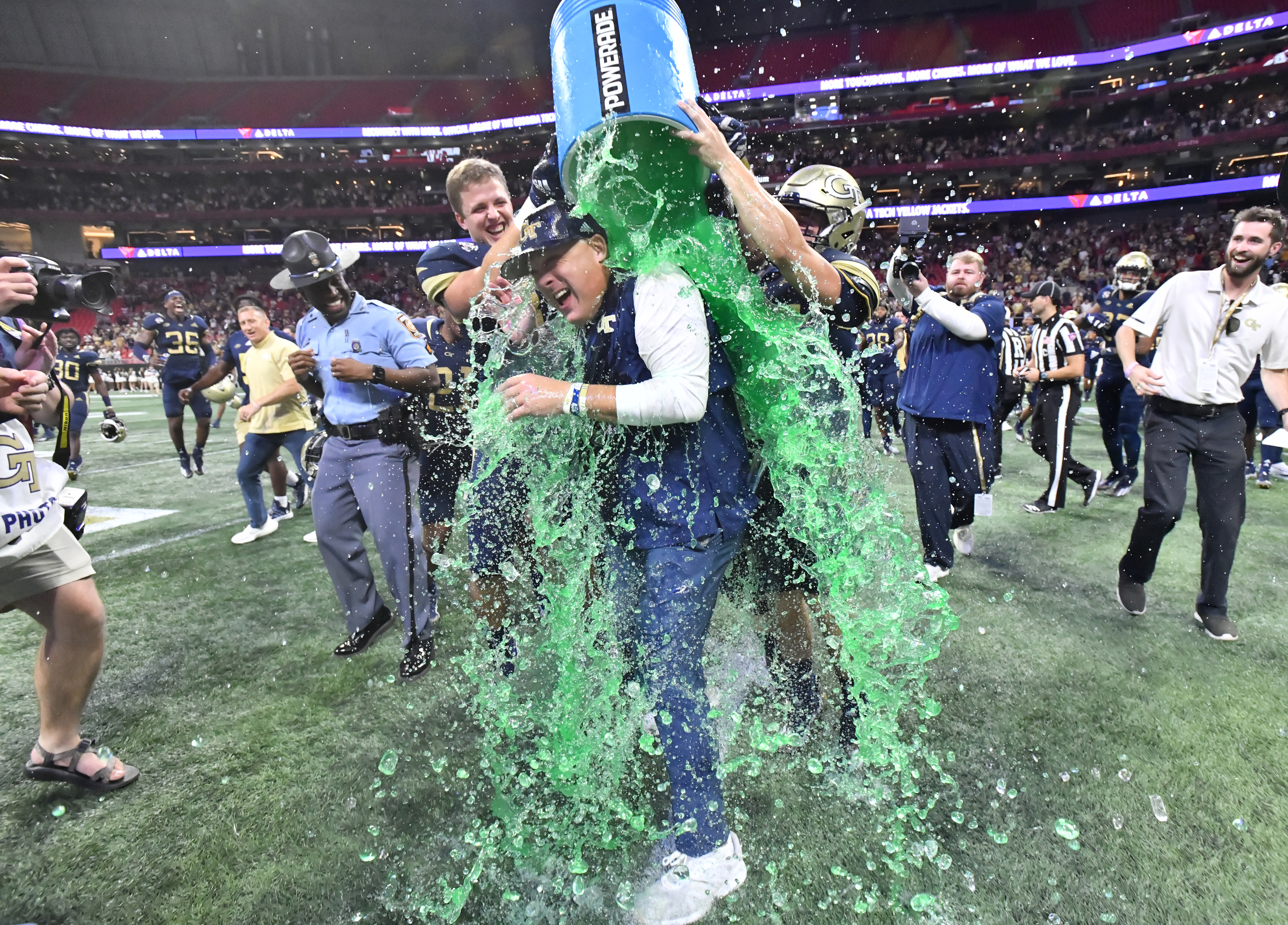 Georgia Tech head coach Geoff Collins is dunked with Gatorade by players after 45-22 win over North Carolina Saturday, Sept. 25, 2021, at Mercedes-Benz Stadium in Atlanta. (Hyosub Shin / Hyosub.Shin@ajc.com)