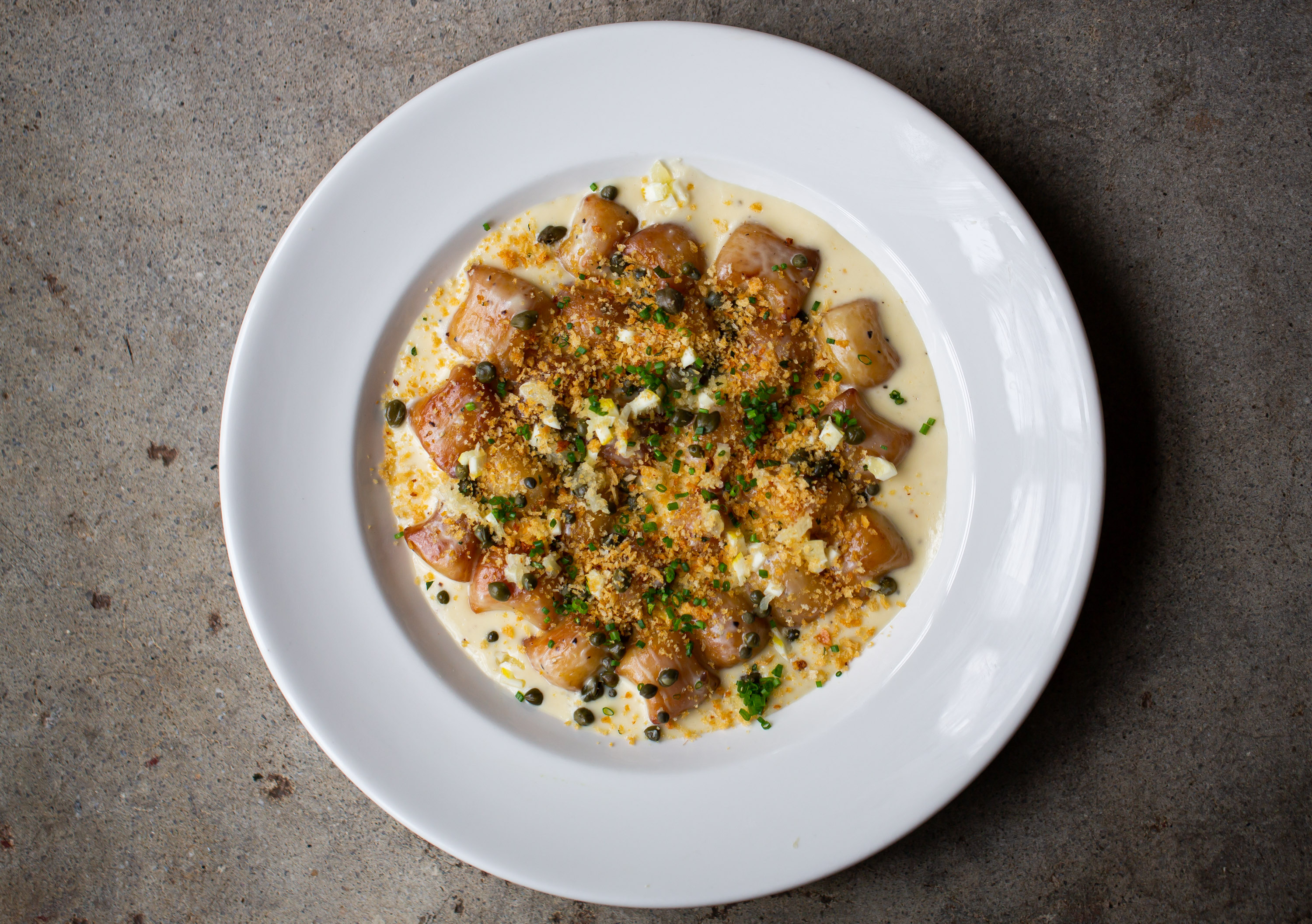 Light, delicate gnocchi in a lemon-like caper cream sauce is one of the transfers from Adele's original location in Nashville.  Ryan Fleisher for The Atlanta Journal-Constutition