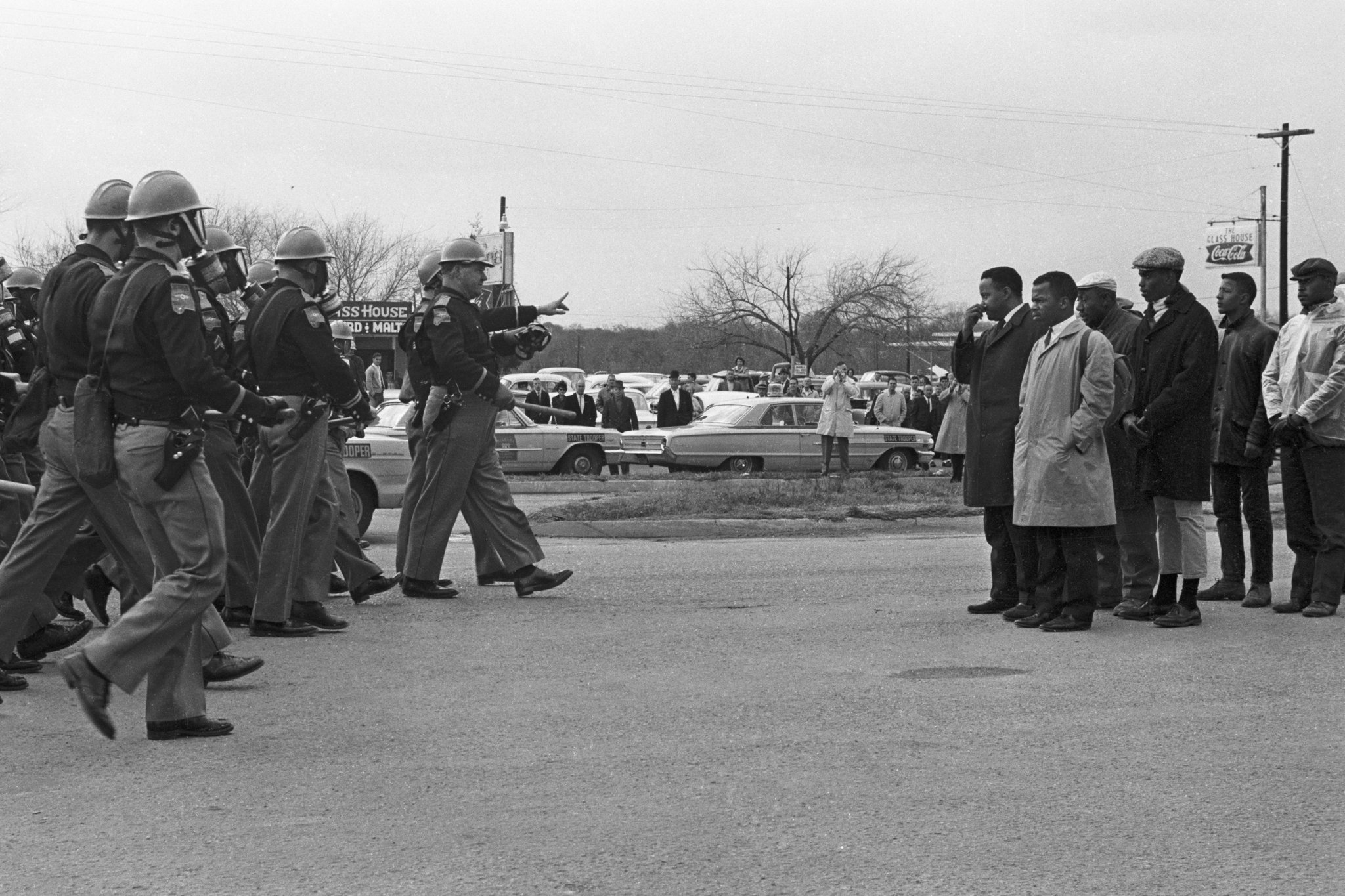 Congressman John Lewis (right side, with tan coat) and Hosea Williams are shown moments before they were attacked by Alabama state troopers on March 7, 1965. It’s a day that would be known as “Bloody Sunday.” (Courtesy of Magnolia Pictures)