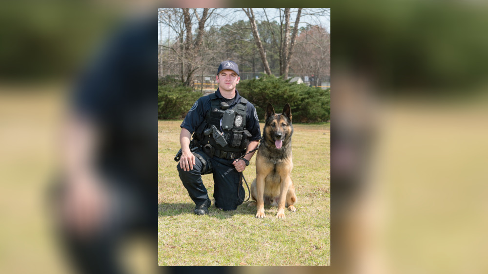 Clayton County police dog Odin is shown with his handler, Officer Baker. (Photo: Clayton County Police Department)