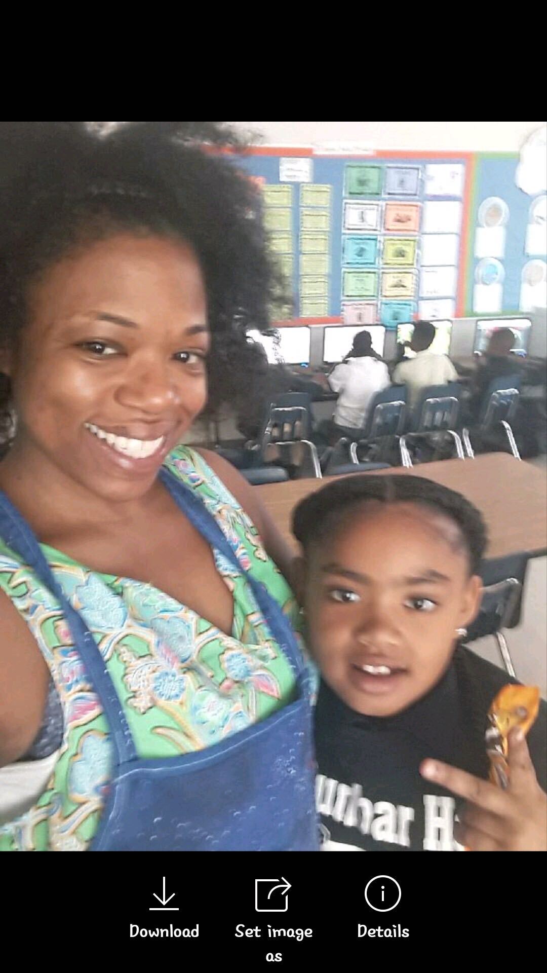 Dunbar Elementary School teacher Joya Florence takes photos with her former student Secoriea Turner. Secoriea was fatally shot Saturday night, July 4, 2020 in Atlanta.