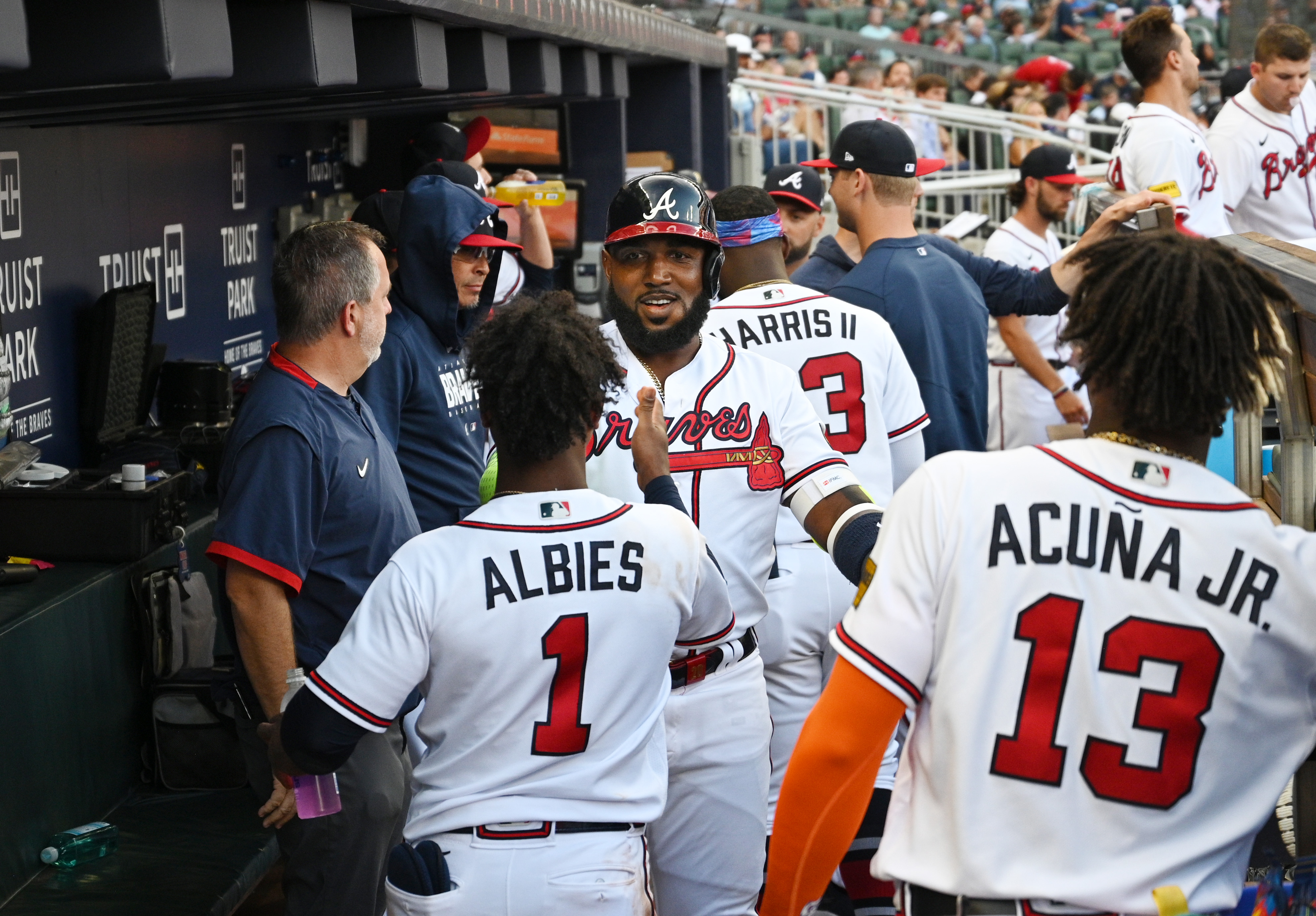 2 fans charged after running onto Coors Field, grabbing Braves outfielder Ronald  Acuña Jr.