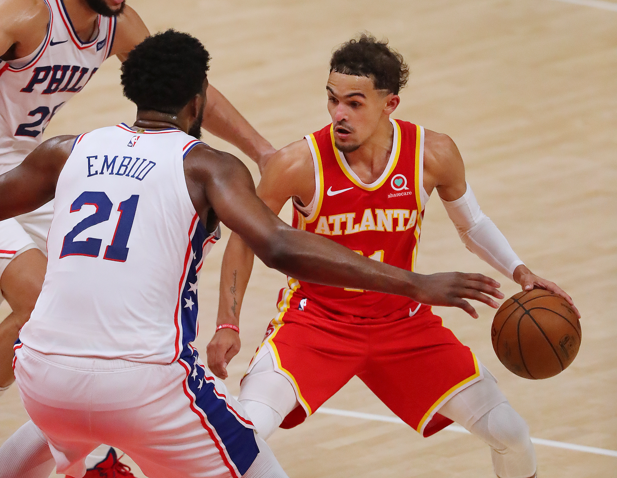 Hawks guard Trae Young finds his drive blocked by Philadelphia 76ers center Joel Embiid in game 3 of their NBA Eastern Conference semifinals series on Friday, Jun 11, 2021, in Atlanta. “Curtis Compton / Curtis.Compton@ajc.com”