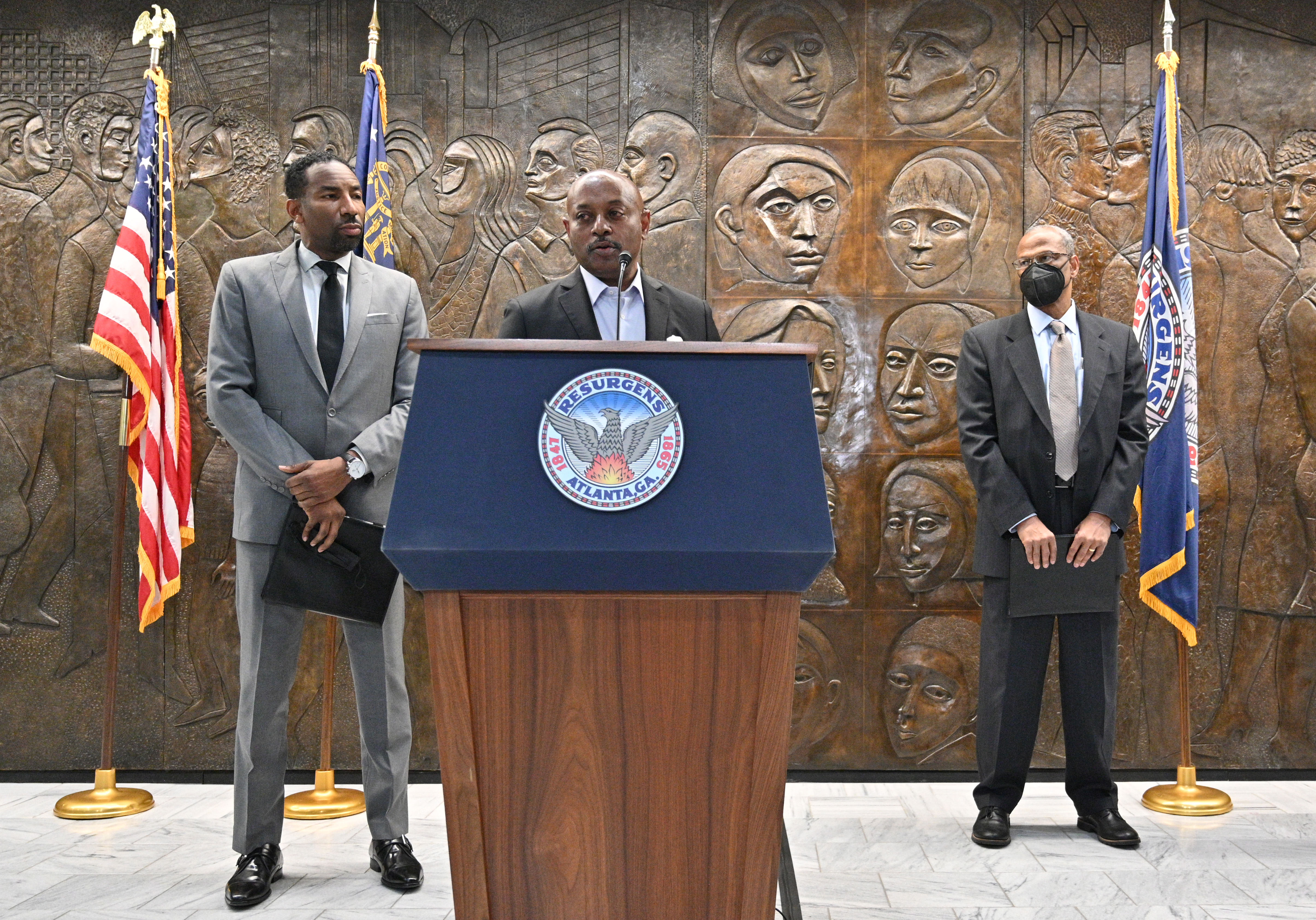 Atlanta Housing Authority President Eugene Jones speaks alongside Mayor Andre Dickens and Integral Group CEO Egbert Perry on Thursday, February 3, 2022. (Hyosub Shin / Hyosub.Shin@ajc.com)