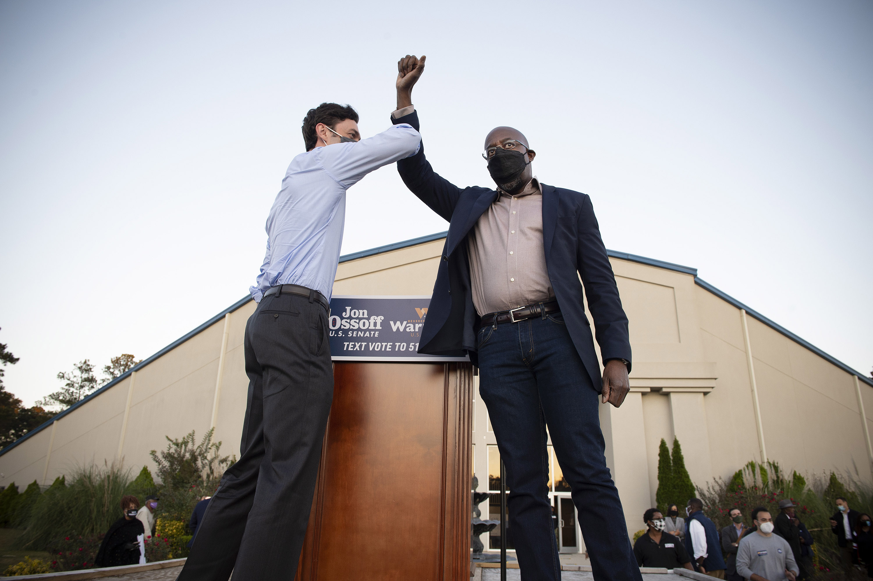 Democratic U.S. Senate candidates Jon Ossoff, left, and Raphael Warnock both supported President Donald Trump's call for increasing stimulus payments to $2,000. (Robin Rayne/Zuma Press/TNS)