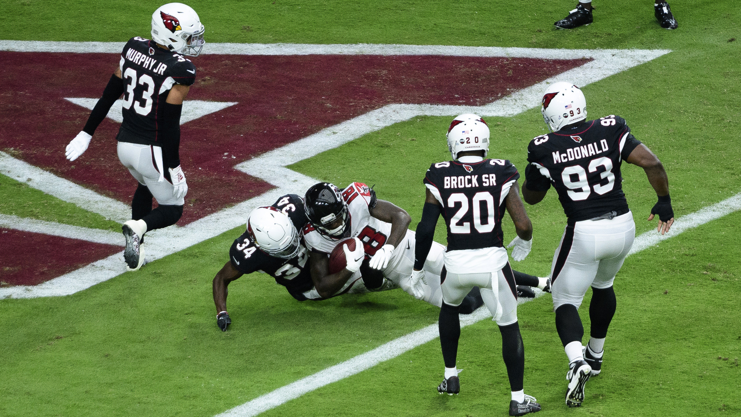 Cardinals beat Falcons 34-33 after Bryant's extra point miss