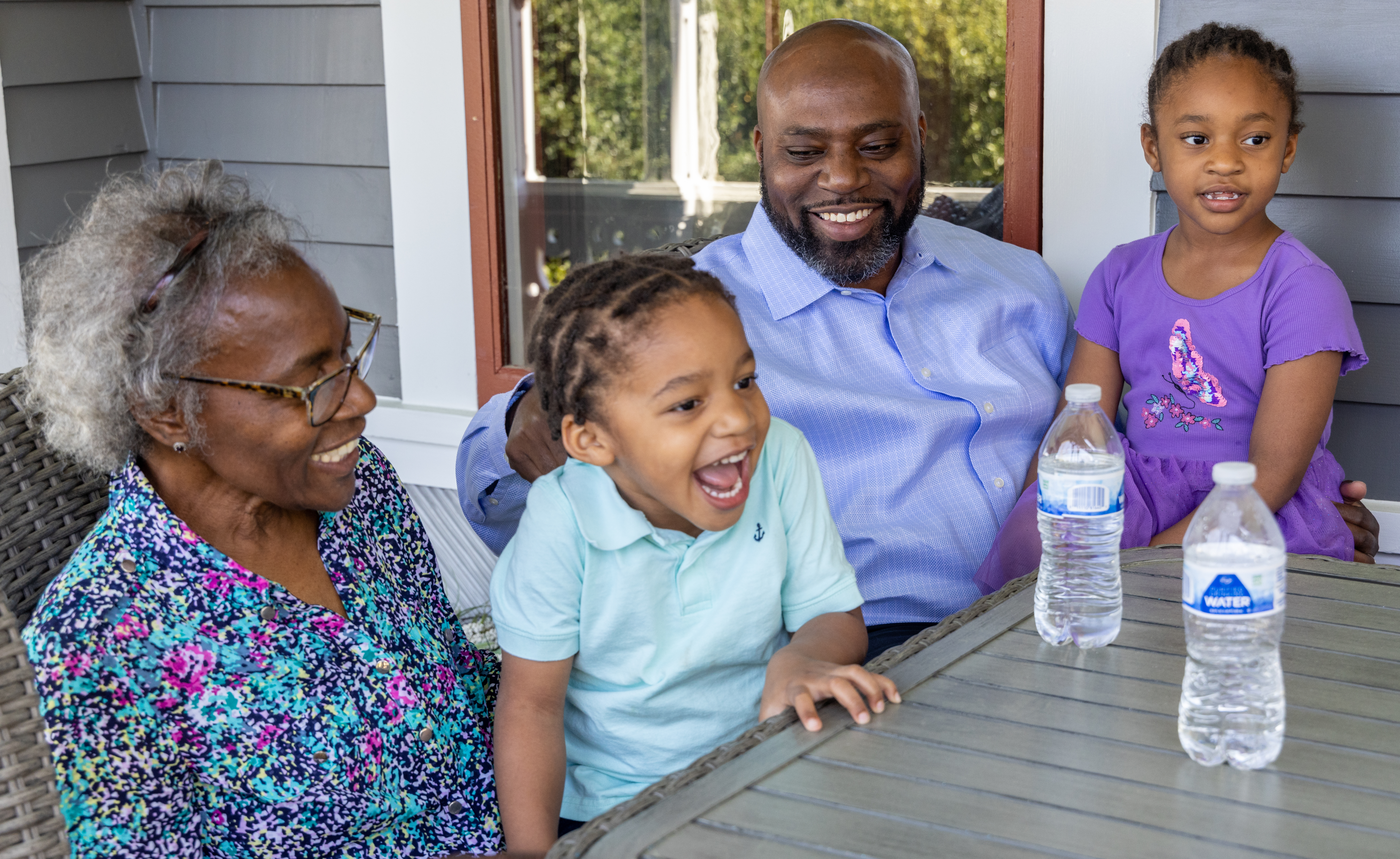 (left to right) Mary Durden watches her grandson Frederick "Tre" (age 3) laugh and squirm while being tickled by his father Frederick as his sister Zoe (age 5) sits with them on the porch of their Newnan home. Dr. Frederick Durden has been surrounded by great mentors since childhood and is now taking all the influence and encouragement he received and is channeling outward. He has great humility and perspective and wants to serve others as he's been served throughout his life. Despite a busy career as a plastic surgeon, he is also a devoted husband, father of three young children, and makes times to lead cancer support groups at his church (and much more). PHIL SKINNER FOR THE ATLANTA JOURNAL-CONSTITUTION.