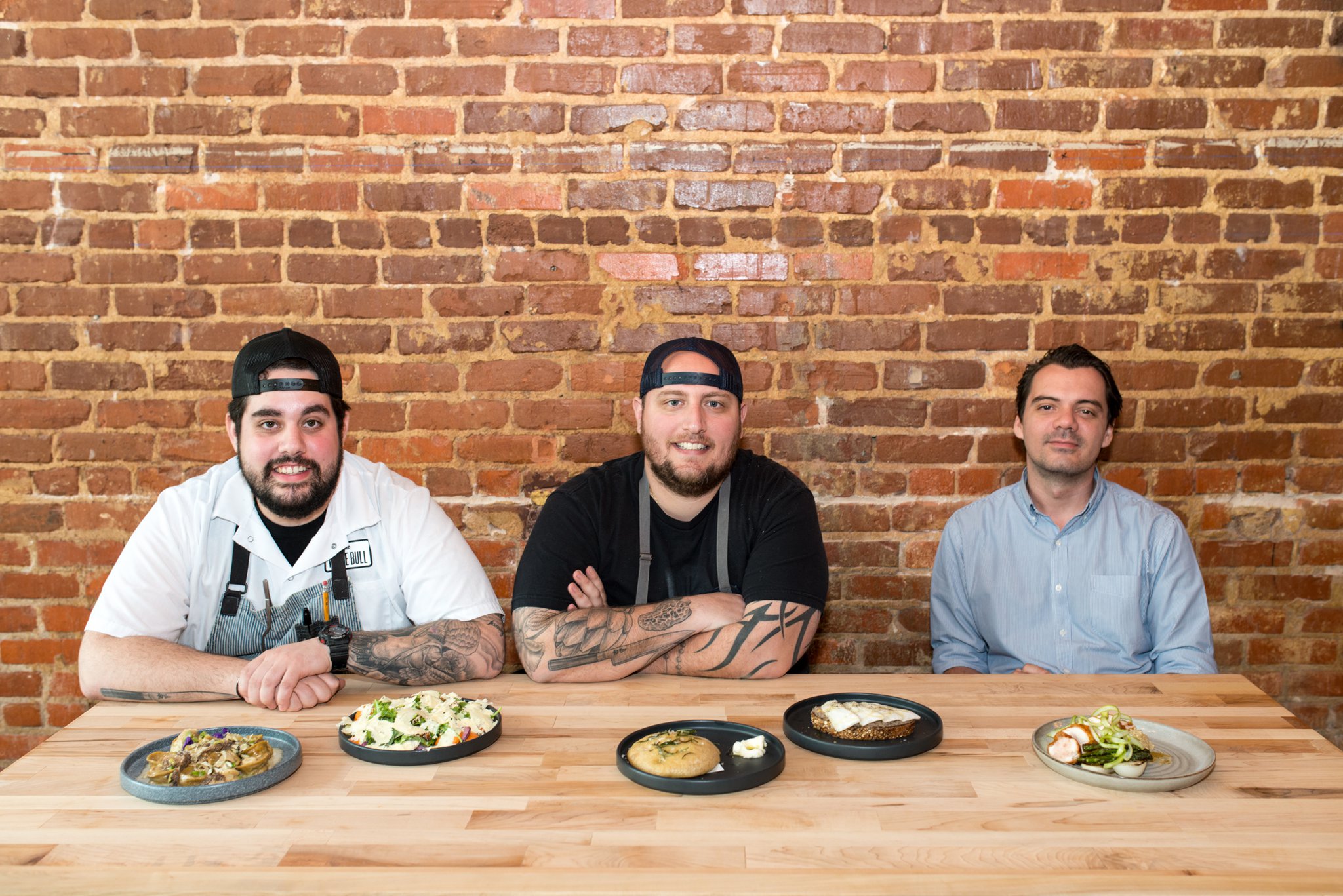 The White Bull owners: (from left to right) sous chef Pat Siciliano, executive chef Pat Pascarella, and general manager Gabriele Besozzi. Photo credit- Mia Yakel.