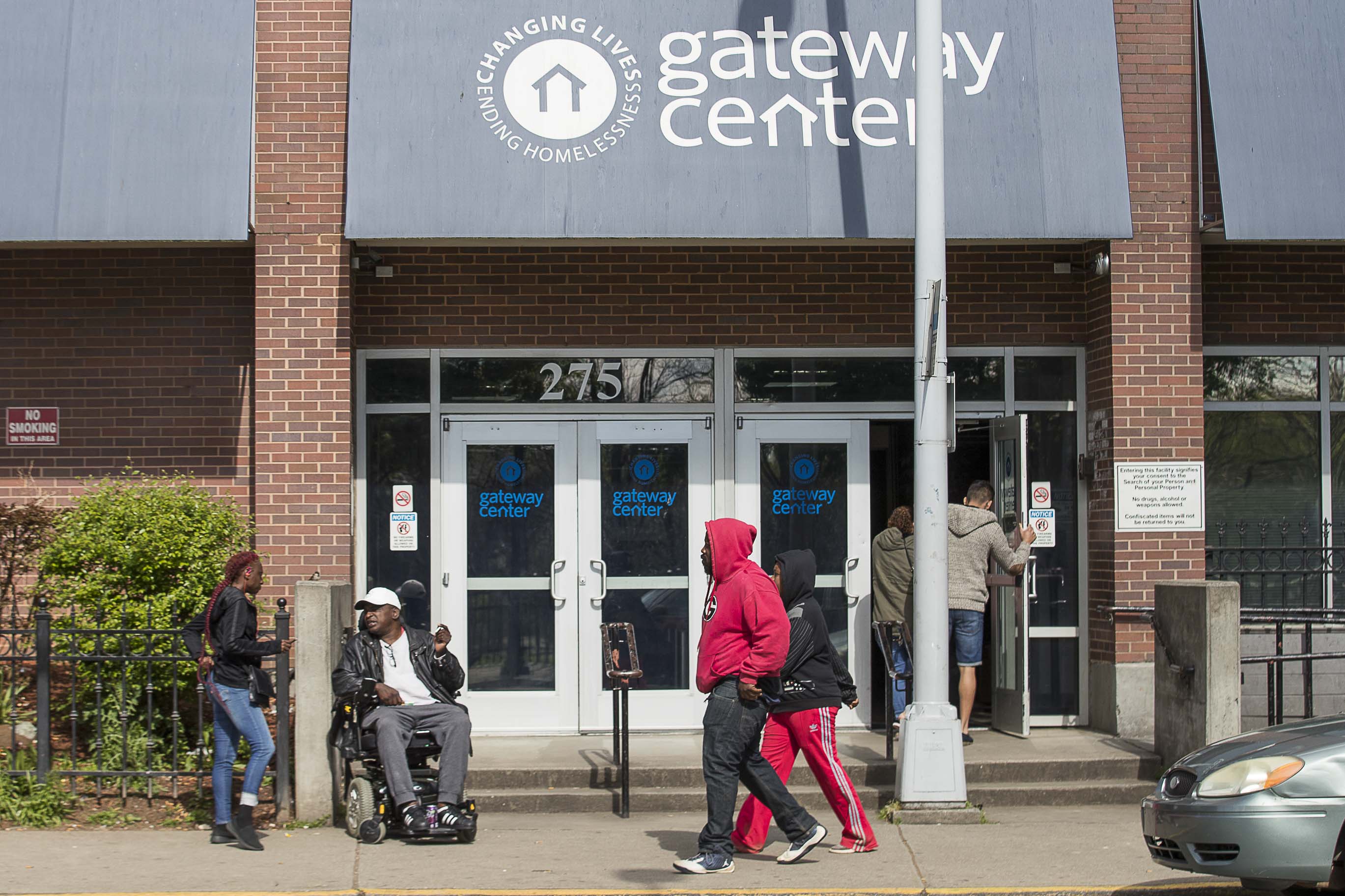 04/01/2020 - Atlanta, Georgia - People gather outside of the Gateway Center in Atlanta, Wednesday, April 1, 2020. The Gateway Center is a homeless service center. (ALYSSA POINTER / ALYSSA.POINTER@AJC.COM)