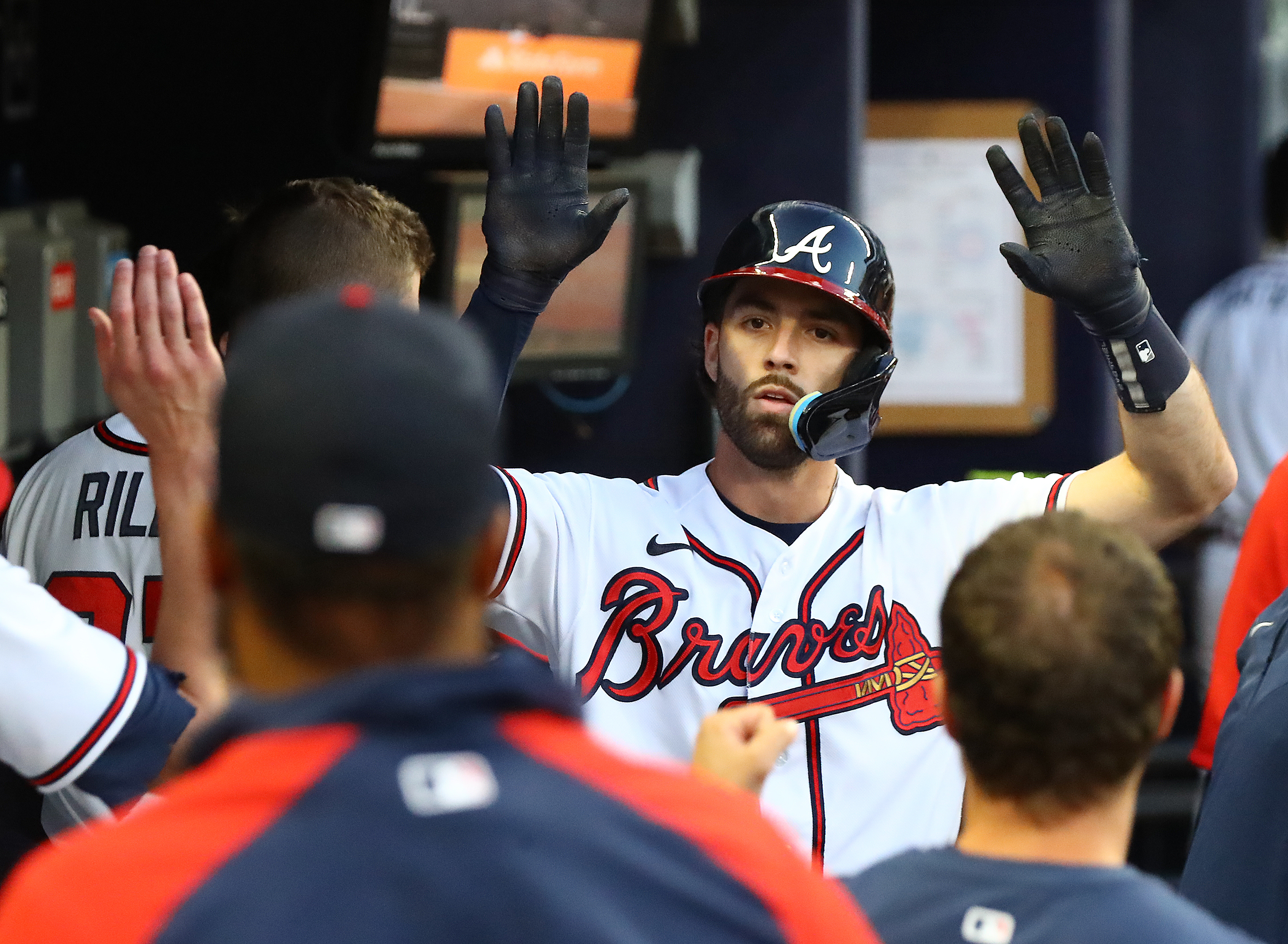 Braves shortstop Dansby Swanson gets high fives in the dugout hitting a solo homer to take a 2-1 lead over the Chicago Cubs during the third inning in a MLB baseball game on Thursday, April 28, 2022, in Atlanta. “Curtis Compton / Curtis.Compton@ajc.com”