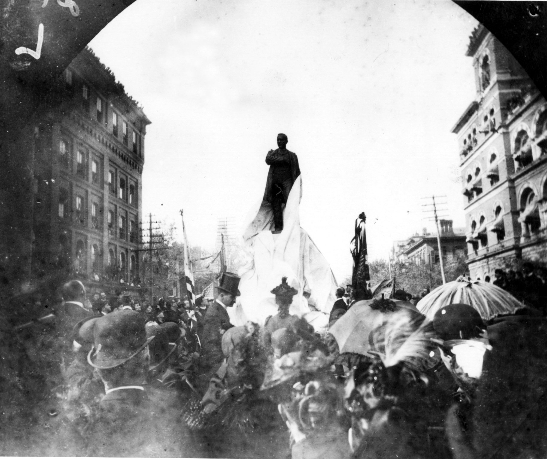 Photo taken on Oct. 21, 1891, shows the unveiling of the Henry Grady statue at Marietta and Forsyth streets. A crowd of 25,000 attended, even lining the tops of buildings. (credit: Atlanta Historical Society)