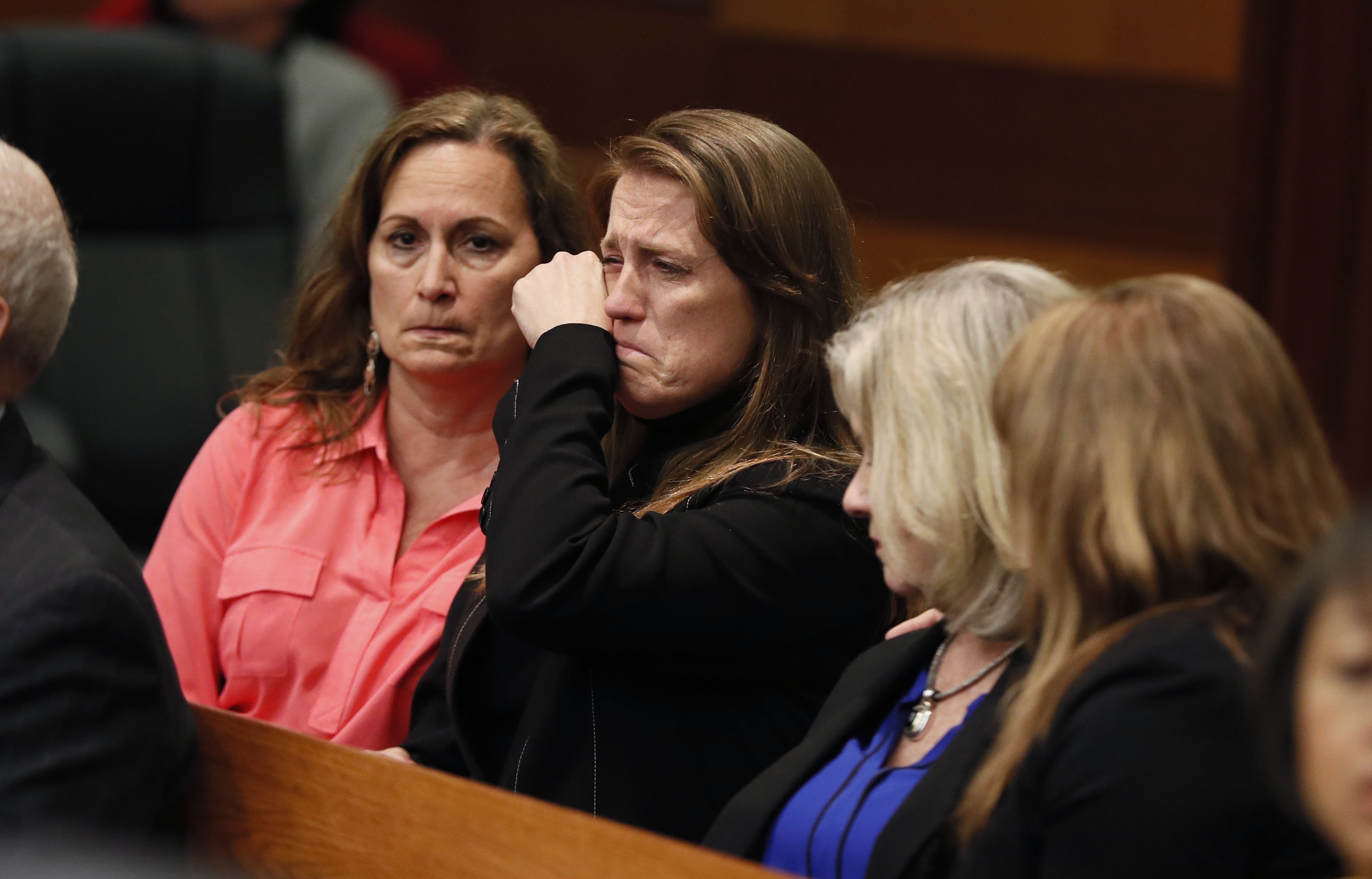 4/23/18 - Atlanta - Tex and Diane McIver's masseuse, Annie Anderson (center), reacts to the verdict. The jury found Tex McIver guilty on four of five charges on their fifth day of deliberations today at the Tex McIver murder trial at the Fulton County Courthouse. Bob Andres bandres@ajc.com