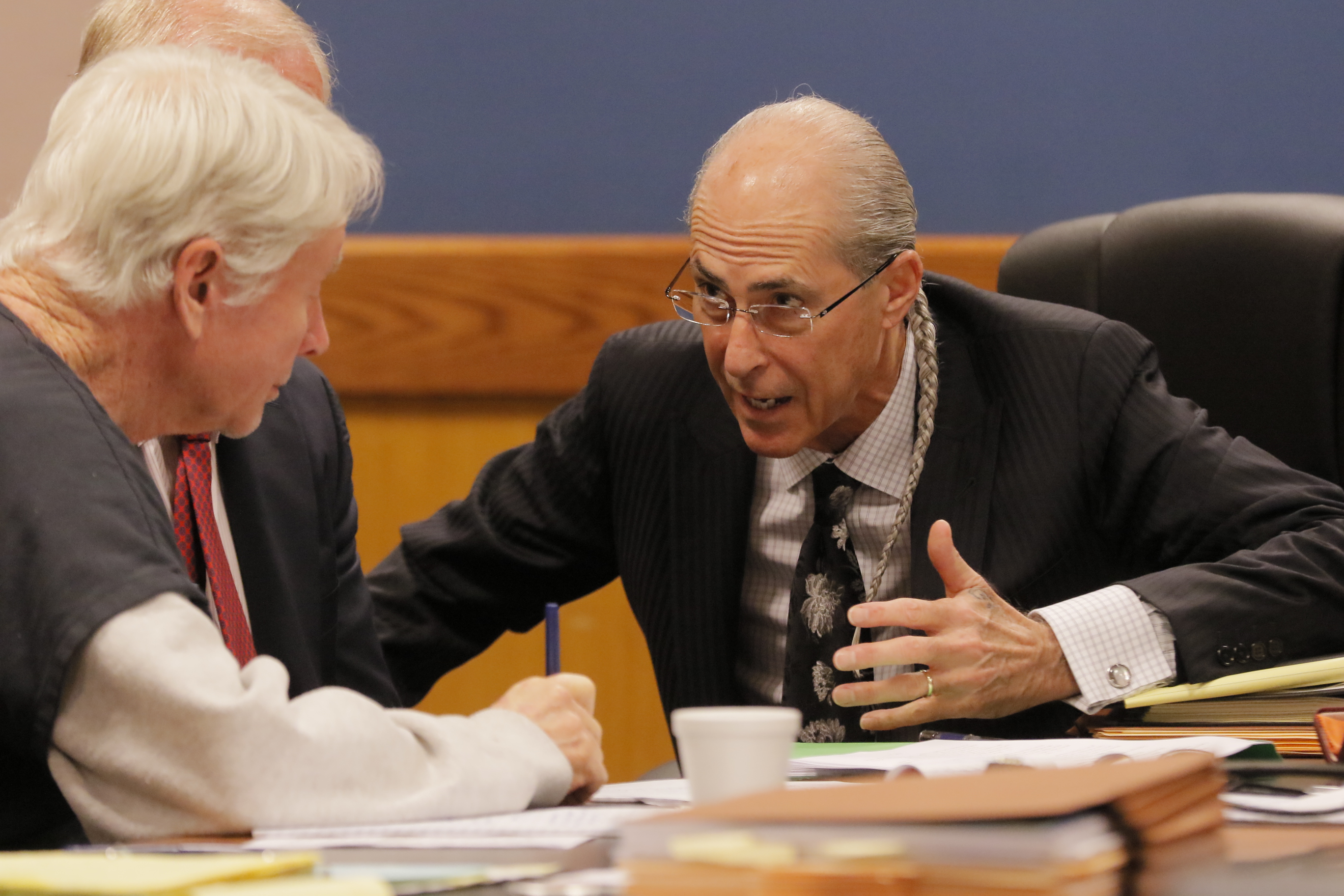 Tex McIver confers with attorney Bruce Harvey in this September 2017 file photo. Harvey will become McIver's only remaining attorney.