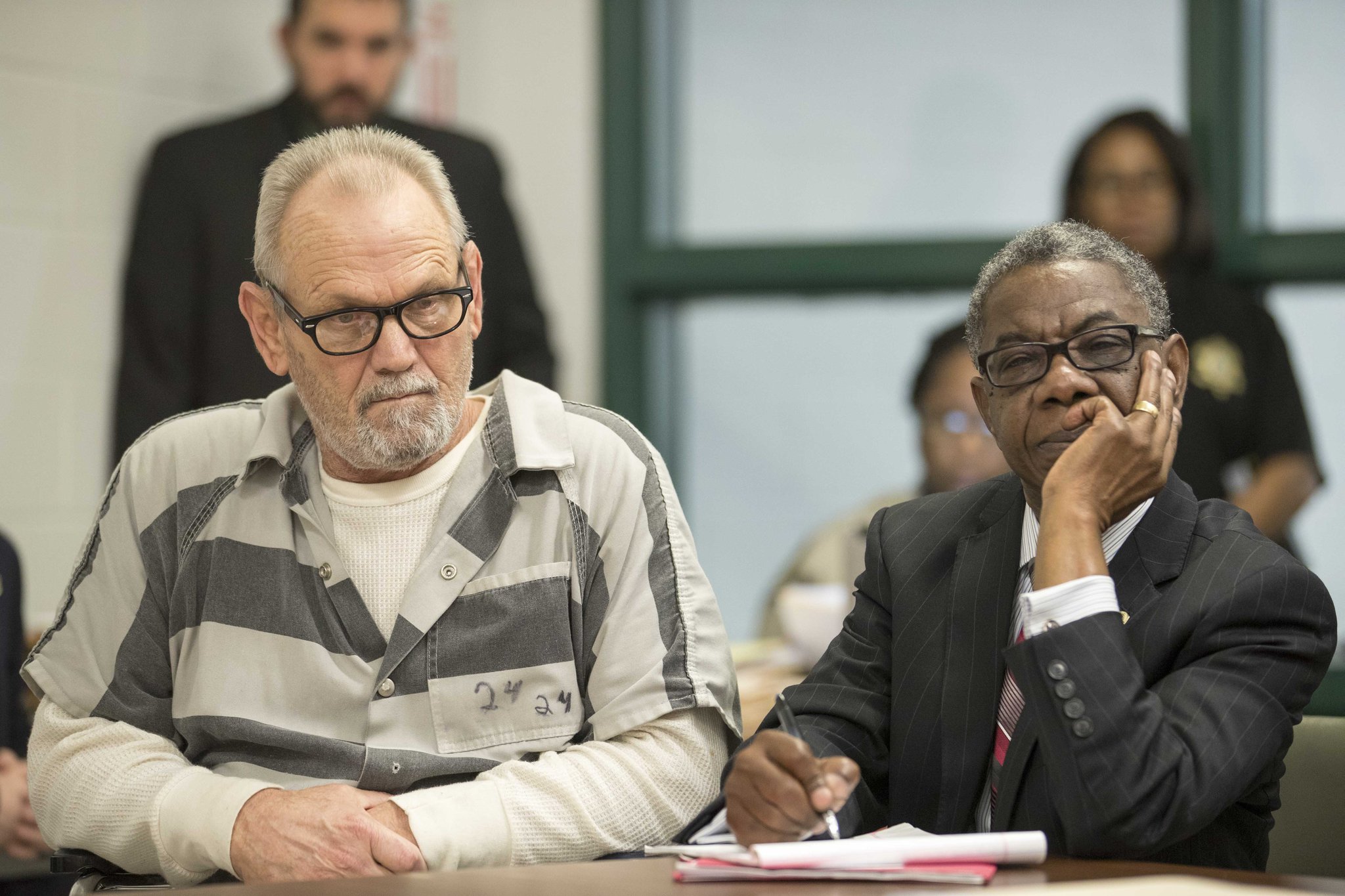 Bill Moore Sr. and his lawyer, Harry Charles, right, listen during a preliminary hearing in a Spalding County courtroom on November 30, 2017. Moore and Franklin Gebhardt are accused of killing Timothy Coggins in 1983. Authorities say the killing was racially motivated.