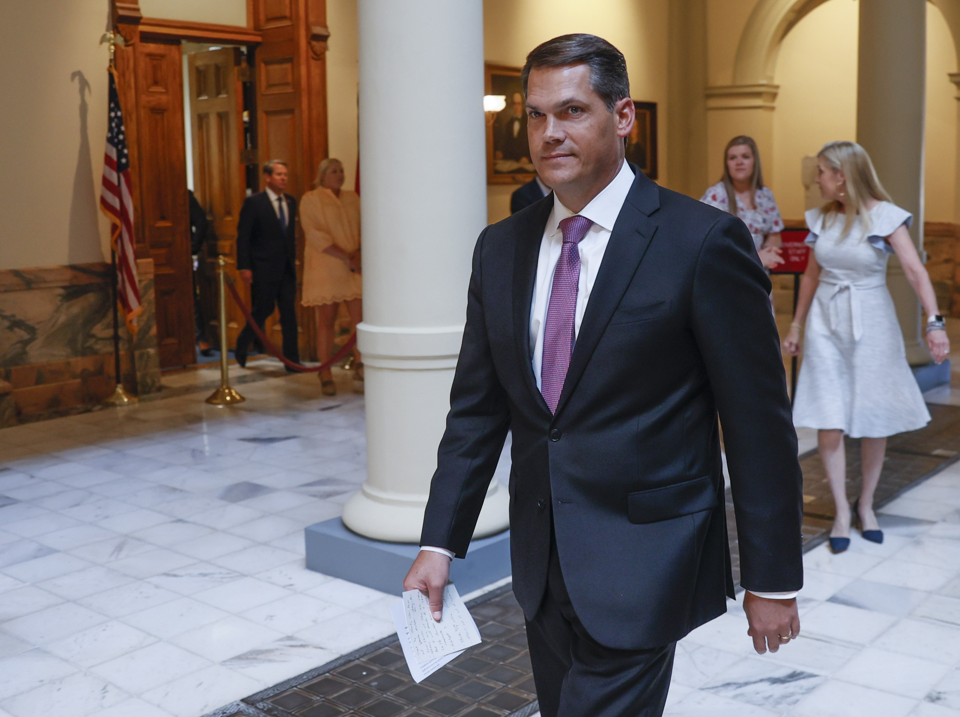 Lt. Gov. Geoff Duncan leads the entourage to the bill signing, as Gov. Brian Kemp enters from the door at left. With much fanfare, Gov. Brian Kemp signsed HB 1013, which aims to increase access to mental health coverage in Georgia on Sine Die, the last day of the General Assembly at the Georgia State Capitol in Atlanta on Monday, April 4, 2022. (Bob Andres / robert.andres@ajc.com)