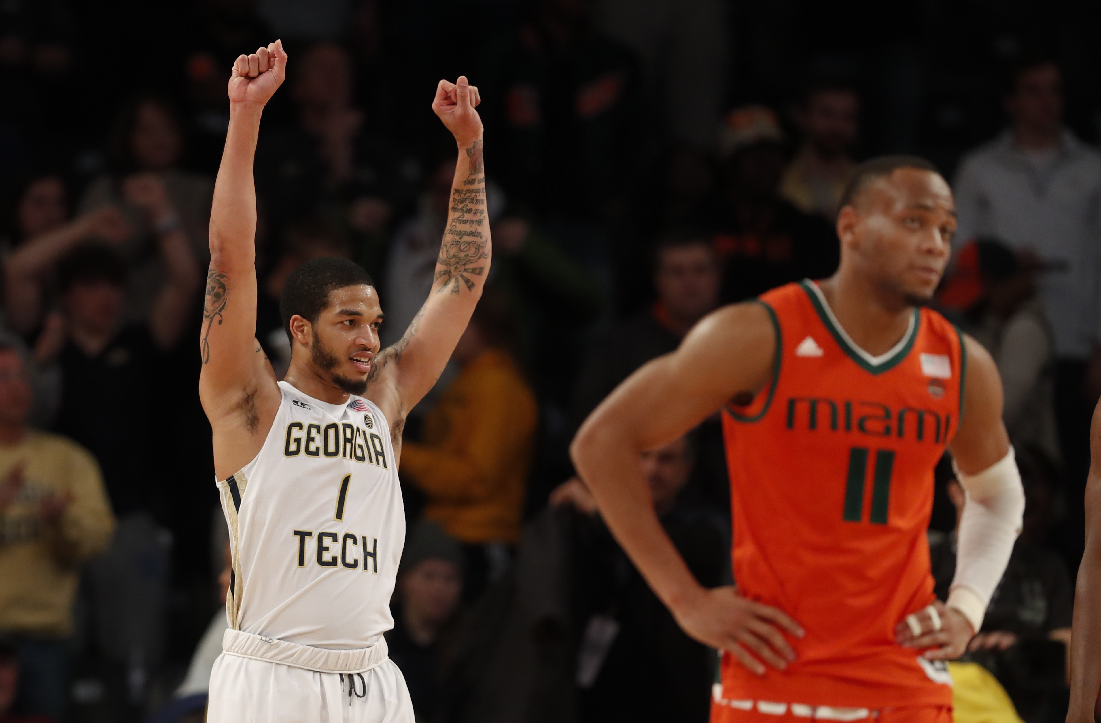 Georgia Tech guard Josh Okogie (5) celebrates with Jon Brown, right, late  in the second half of an NCAA college basketball game against the Miami  Wednesday, Jan. 3, 2018, in Atlanta. Georgia