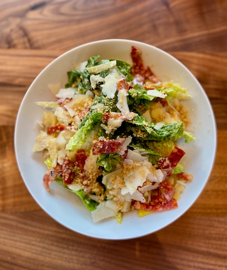 Lucian's salad of lettuce, salami, breadcrumbs and artichokes is a not too heavy lunch on its own.  Wendell Brock for The Atlanta Journal-Constitution