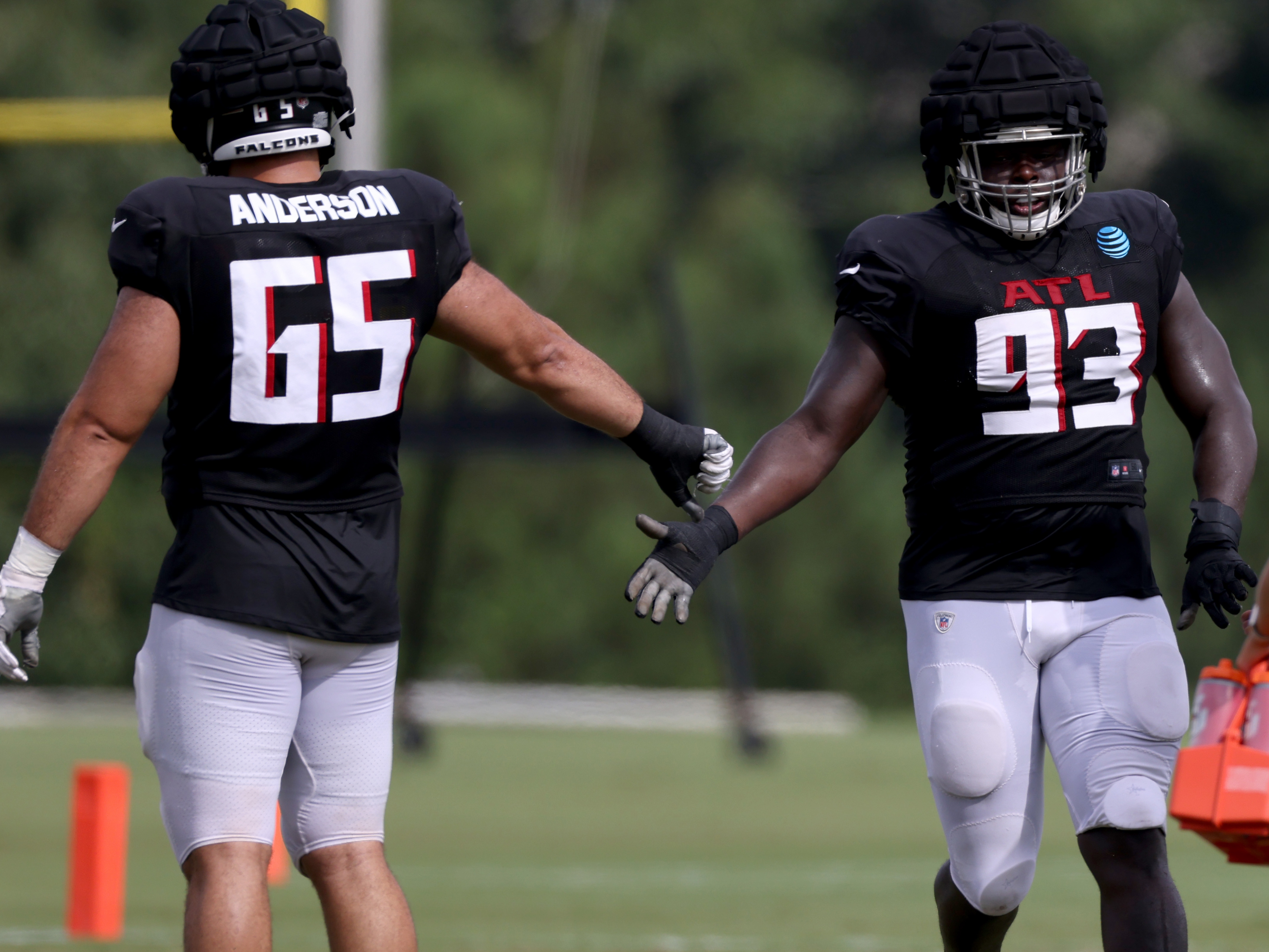 Atlanta Falcons defensive tackle Timmy Horne (93) and wide receiver Drake  London (5) walk off the field after an NFL football game against the  Cleveland Browns, Sunday, Oct. 2, 2022, in Atlanta.