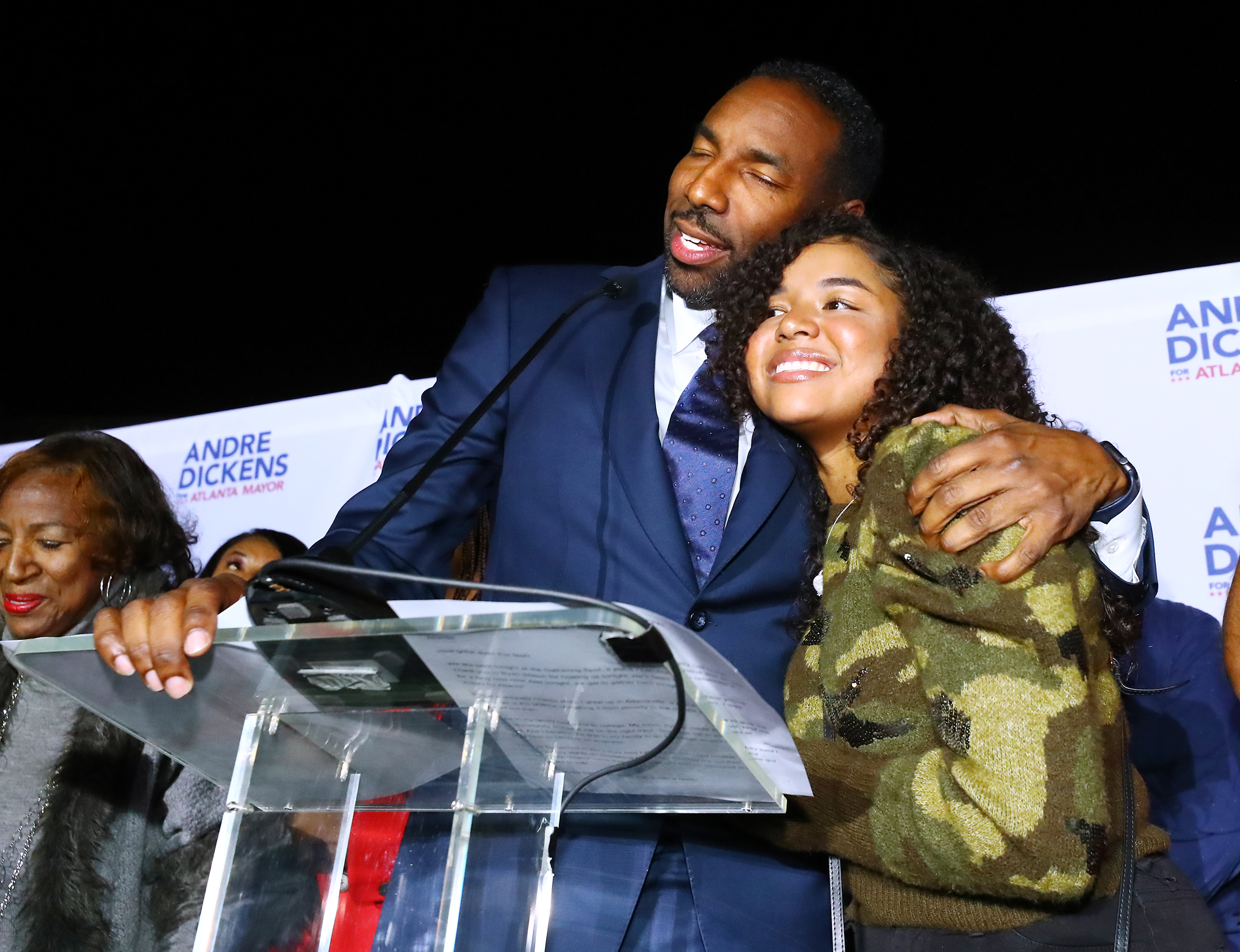 113021 Atlanta: Atlanta Mayor-elect Andre Dickens gives his daughter a hug during his victory address at his election night watch party on Tuesday, Nov. 30, 2021, at the Gathering Spot in Atlanta. “Curtis Compton / Curtis.Compton@ajc.com”`