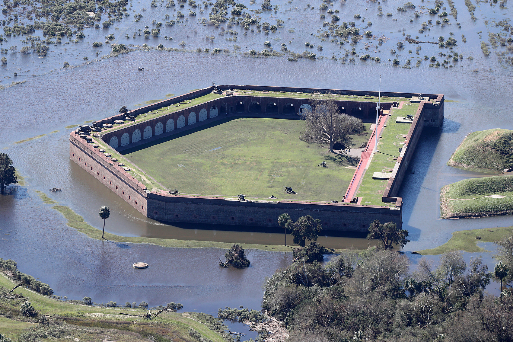 Historic Fort Pulaski National Monument is completely surrounded by flood waters in the aftermath of Hurricane Matthew on Sunday, Oct. 9, 2016, in Savannah.  Curtis Compton /ccompton@ajc.com