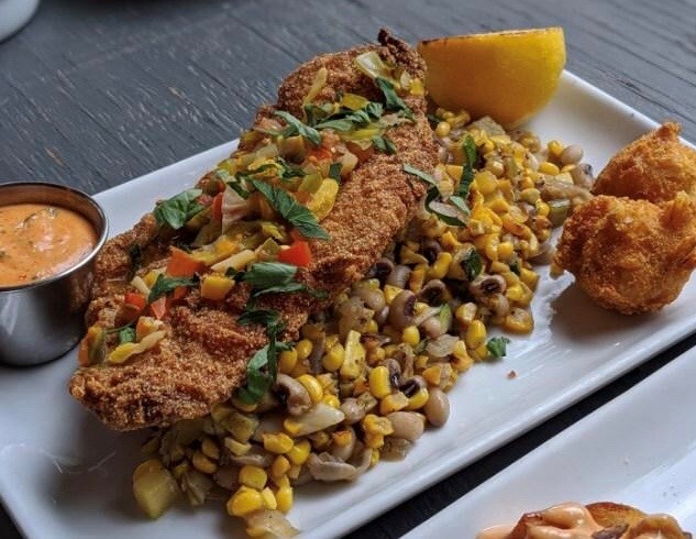 Full Commission’s fried catfish, which comes with succotash, chowchow, spicy remoulade and hush puppies, was inspired by owner David Traxler’s Mississippi roots. CONTRIBUTED BY DAVID TRAXLER