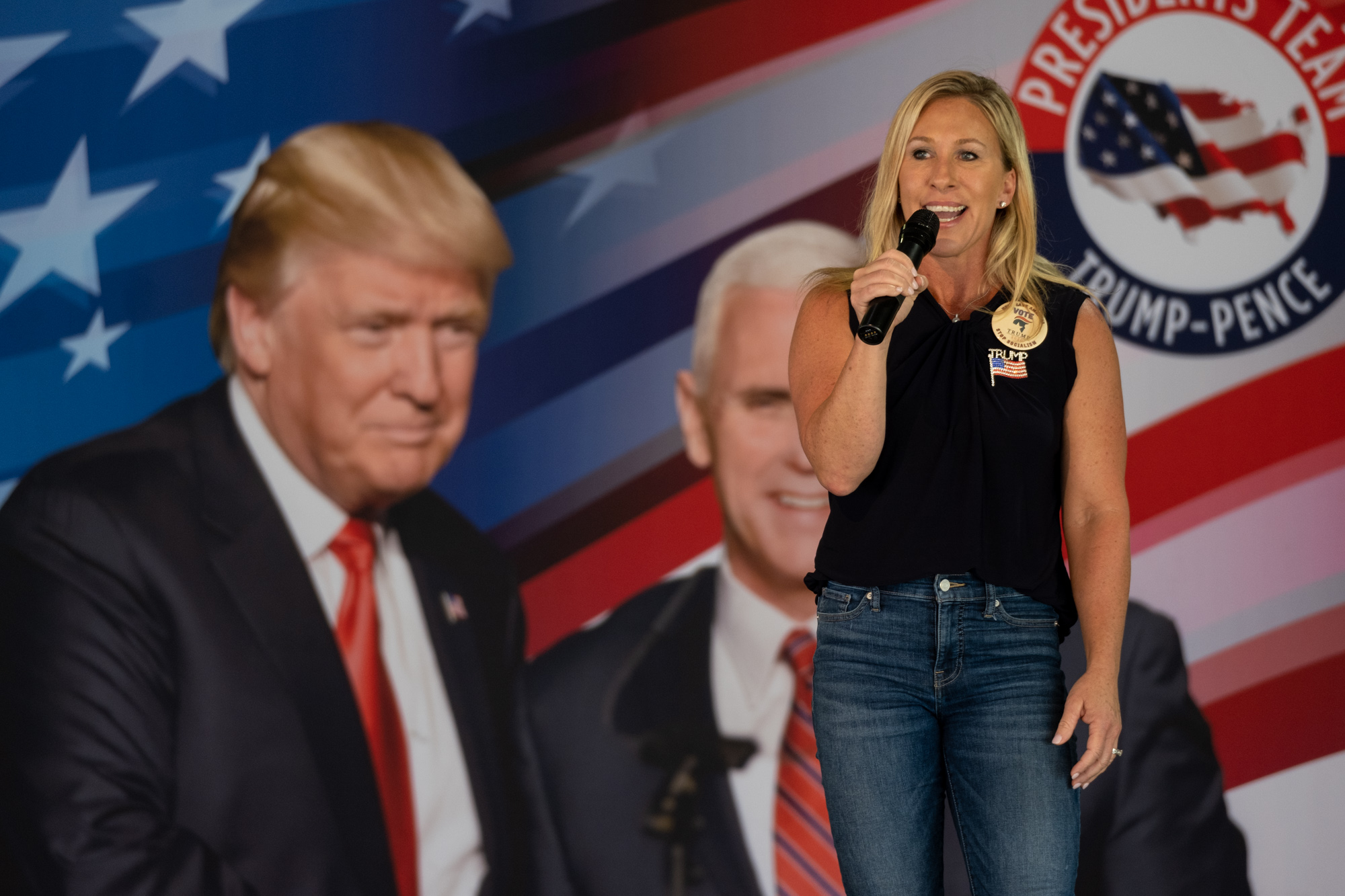 During a political rally at the Rome fairgrounds, Marjorie Taylor Greene said, "The media is already very upset about who I am. And they’re going to continue to be upset because I’m going to support this guy,” as she pointed to a poster of President Donald Trump. (Ben Gray for the Atlanta Journal-Constitution)