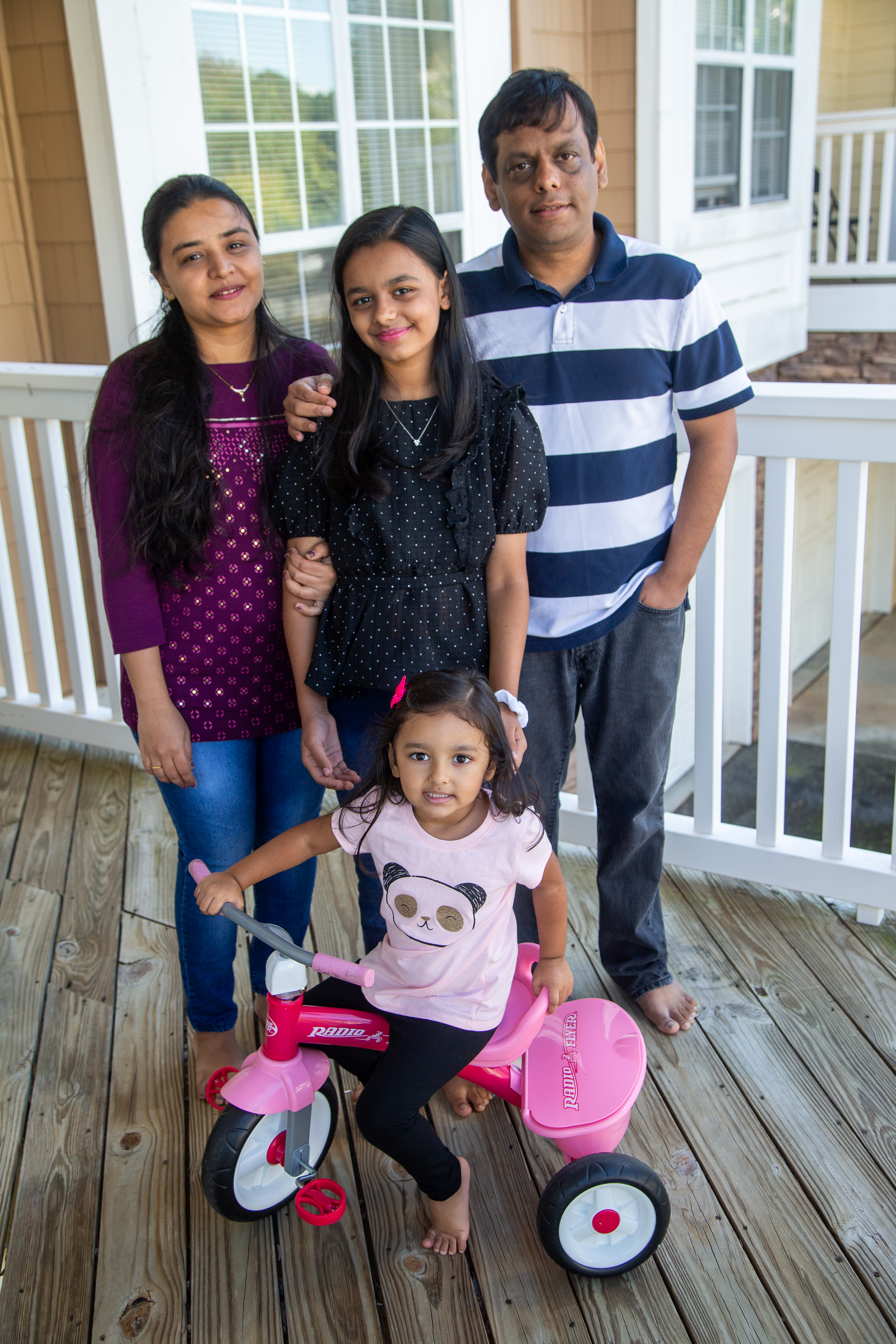 Hita Bhatt (clockwise from left) with her daughter Aesha (age 11), husband Mehul and daughter Hrisha (3) at their Johns Creek home.
PHIL SKINNER FOR THE ATLANTA JOURNAL-CONSTITUTION.
