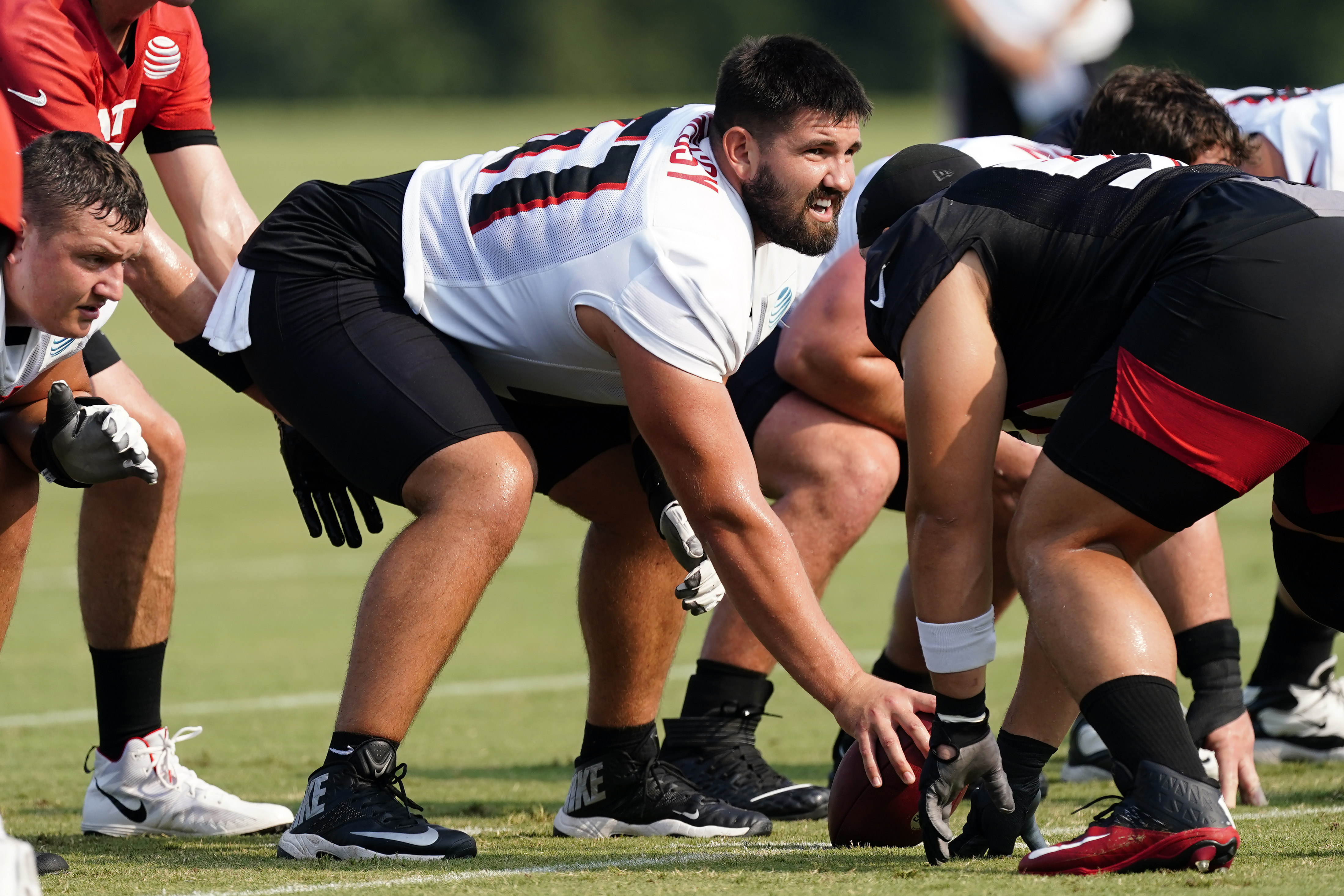 Atlanta Falcons center Matt Hennessy (61) works during the first half of an  NFL football game