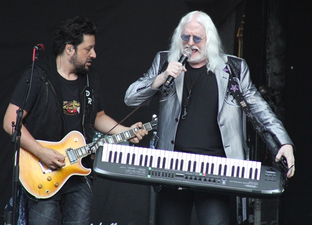 Edgar Winter (and guitarist Doug Rappoport) plays one of many instruments during his set. Photo: Melissa Ruggieri/AJC