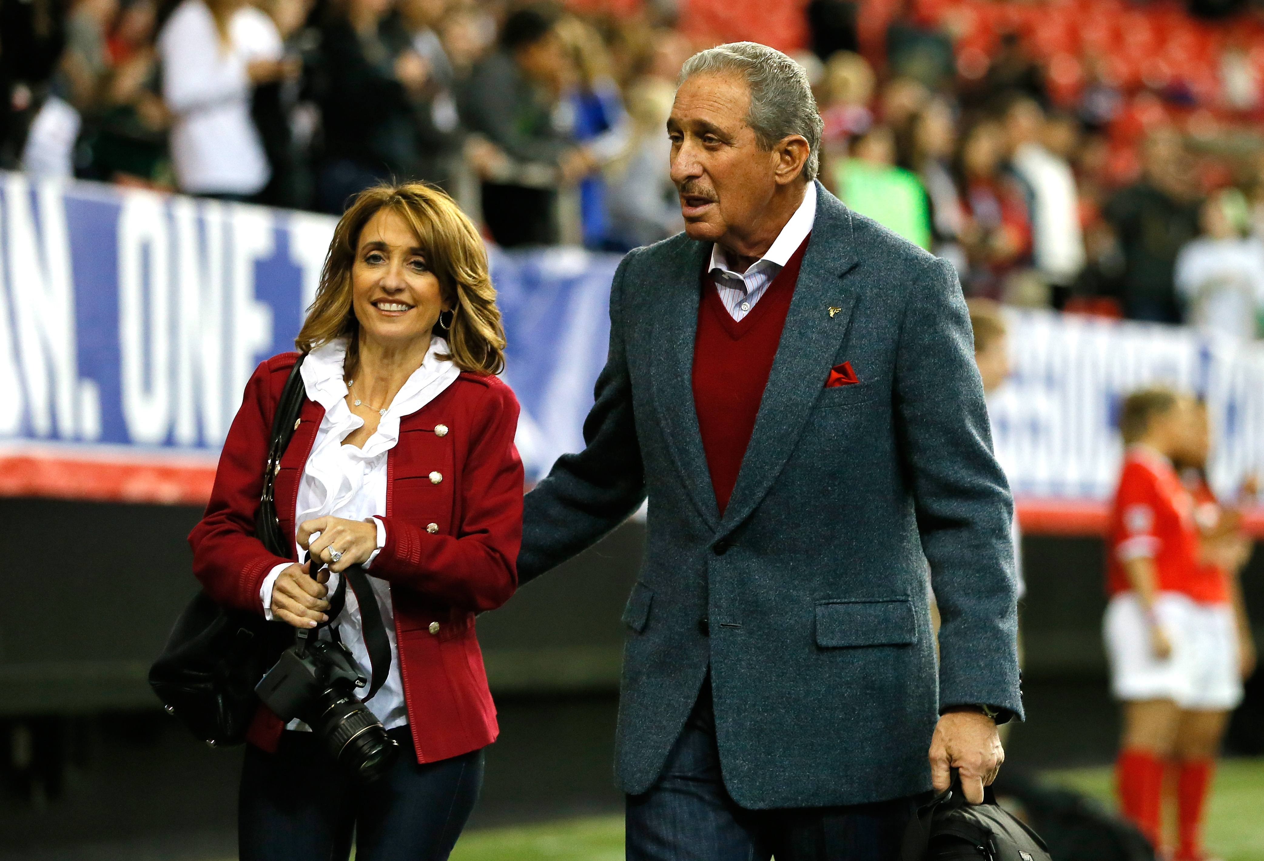 Atlanta Falcons owner Arthur Blank models a new Falcons' jersey during a  press conference and fashion show at the Mall of Georgia in Buford, Ga.,  Thursday, April 24, 2003. The Falcons unveiled