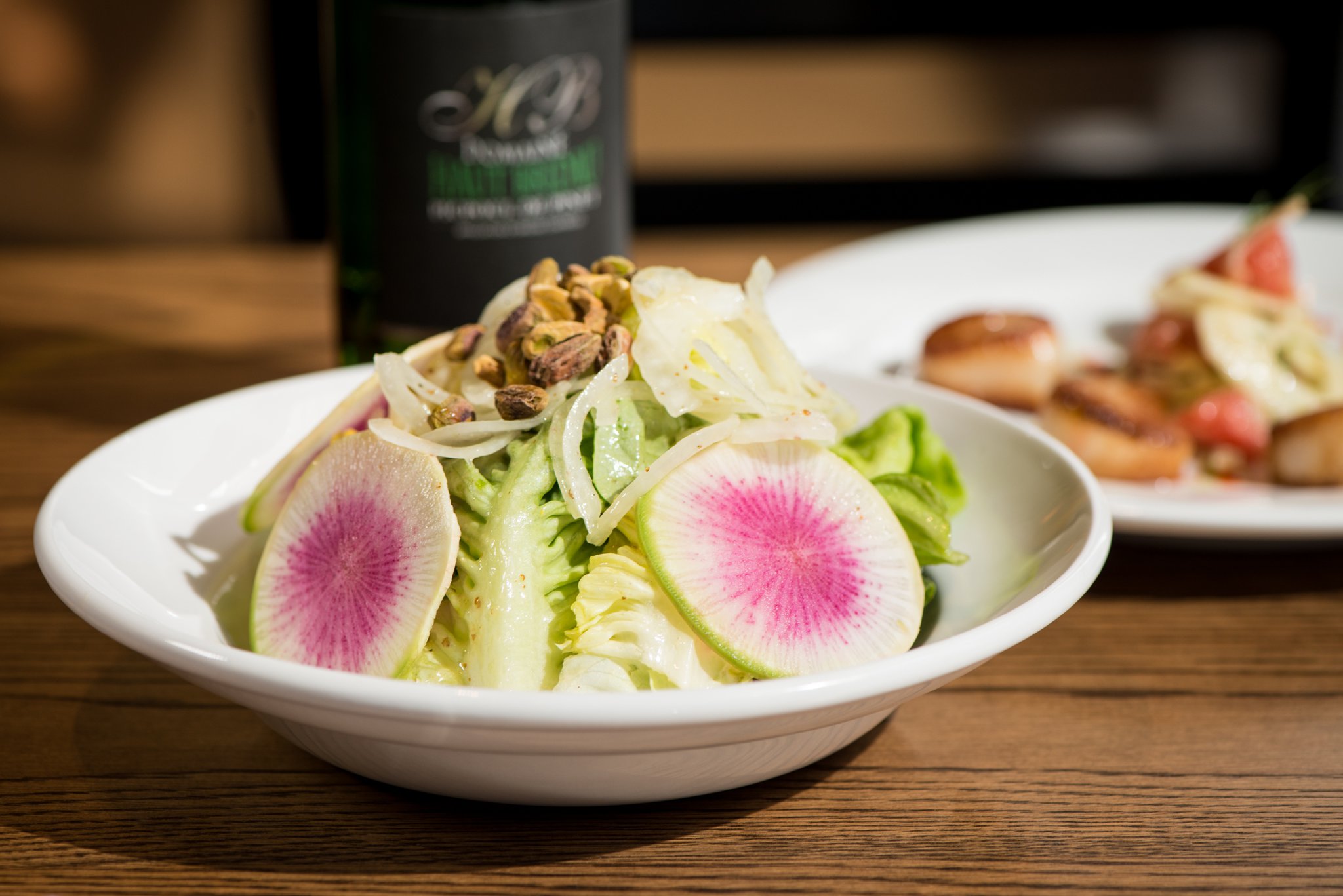 Mediterranea House Salad with Boston lettuce, watermelon radish, sweet onion, and pistachio. Photo credit- Mia Yakel.