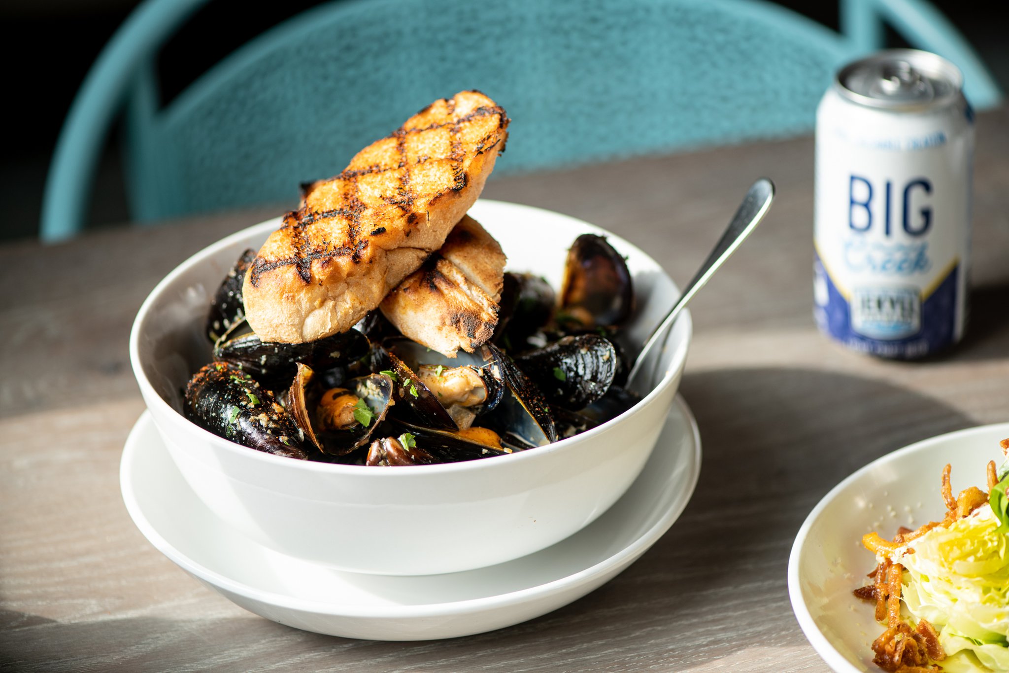 Steamed Mussels with white wine, shallots, garlic, and butter, with Big Creek beer. Photo credit- Mia Yakel