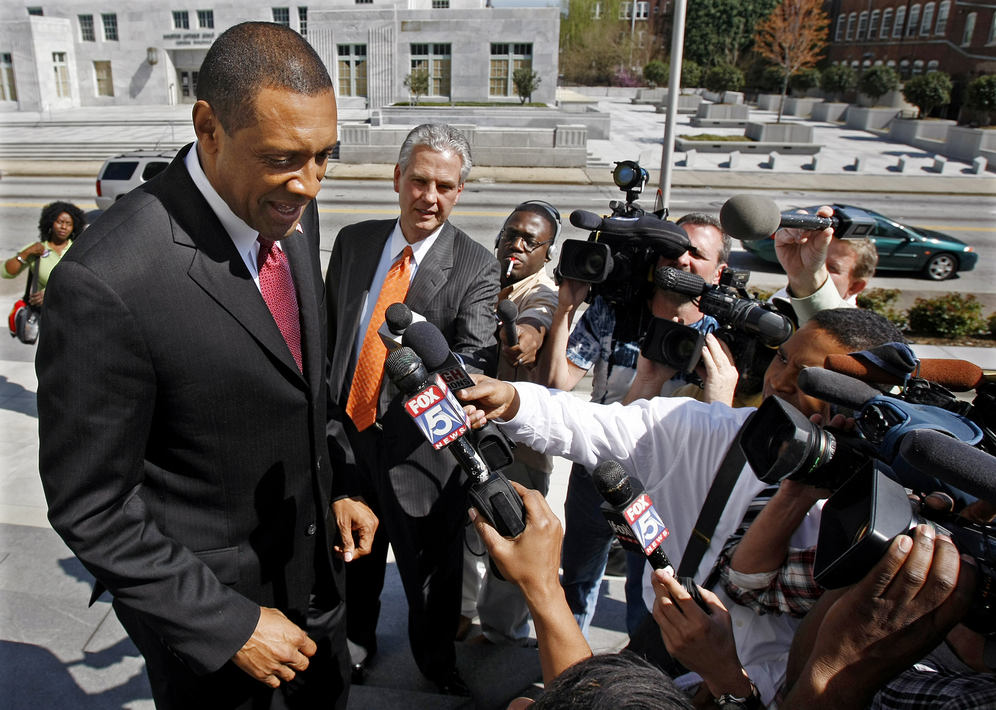 Former DeKalb County CEO Vernon Jones faced a battery of reporters in 2010 outside federal court after a verdict that his administration discriminated against senior white employees. He has largely avoided the media this time around. Curtis Compton ccompton@ajc.com