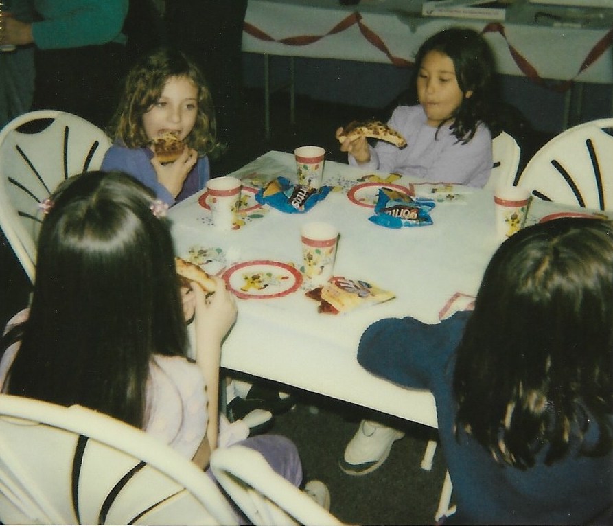 Olivia King and guests at her eighth birthday party enjoy pizza at Suburban Lanes, a former bowling alley in Decatur.  (Courtesy of the King family)
