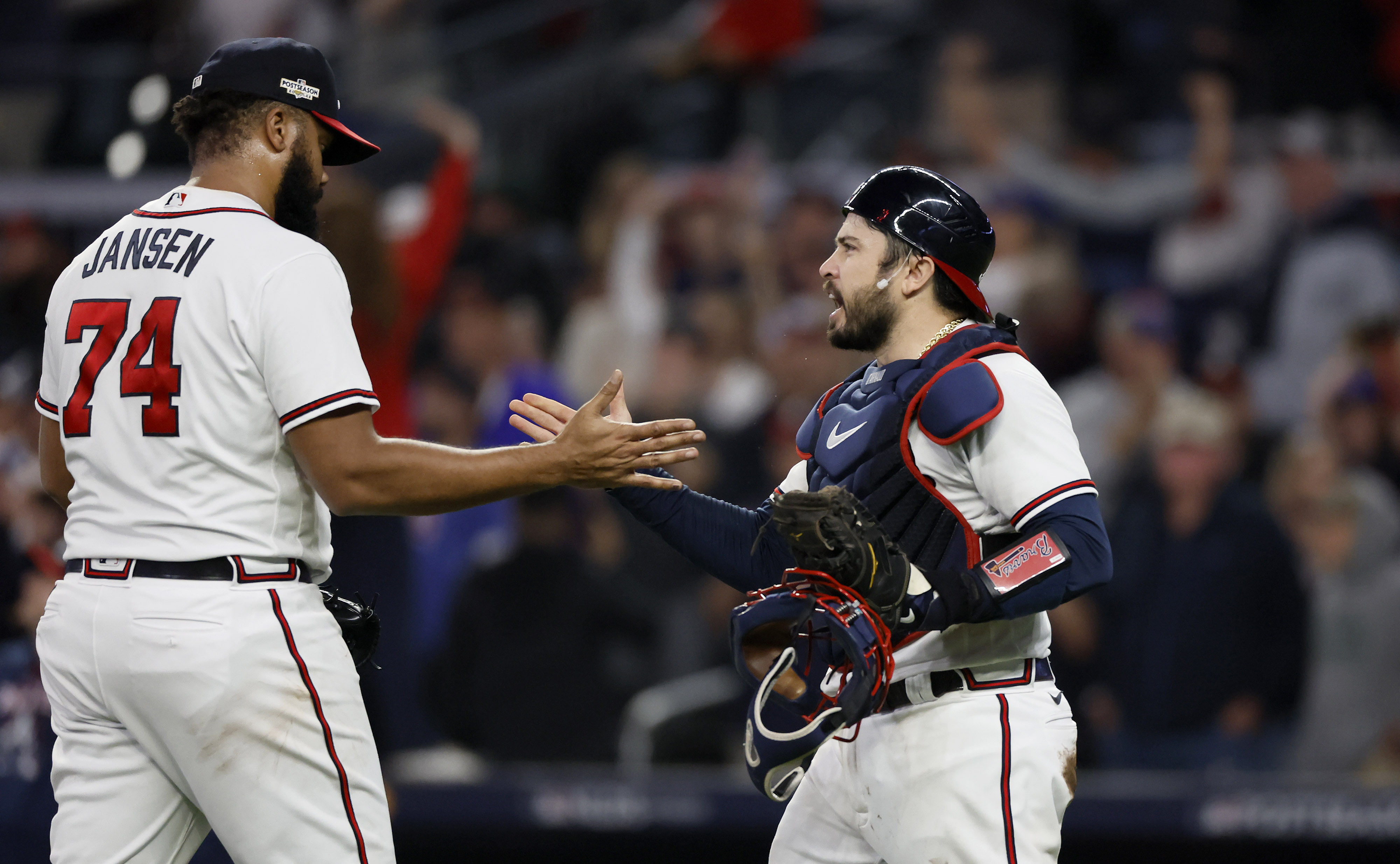 Atlanta Braves first baseman Matt Olson (28) and third baseman Austin Riley  (27) embrace after defeating