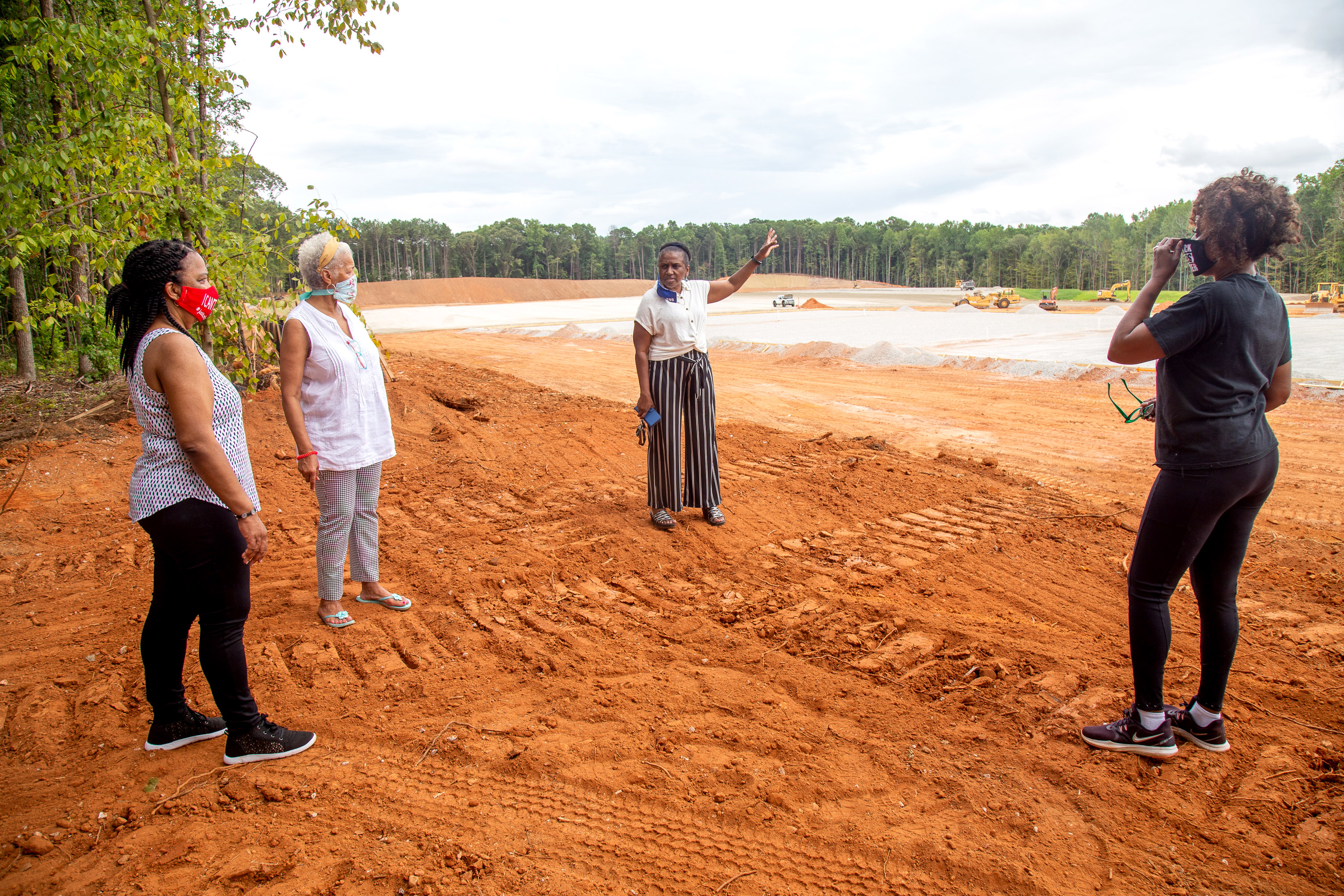 Stonecrest area residents (from left to right) Renee Cail, Jake Bryant, Jennifer Wilson and Pyper Bunch talk about the proposed recycling plant located across the street from their neighborhood. The residents have complained about how close the site is to homes. STEVE SCHAEFER FOR THE ATLANTA JOURNAL-CONSTITUTION