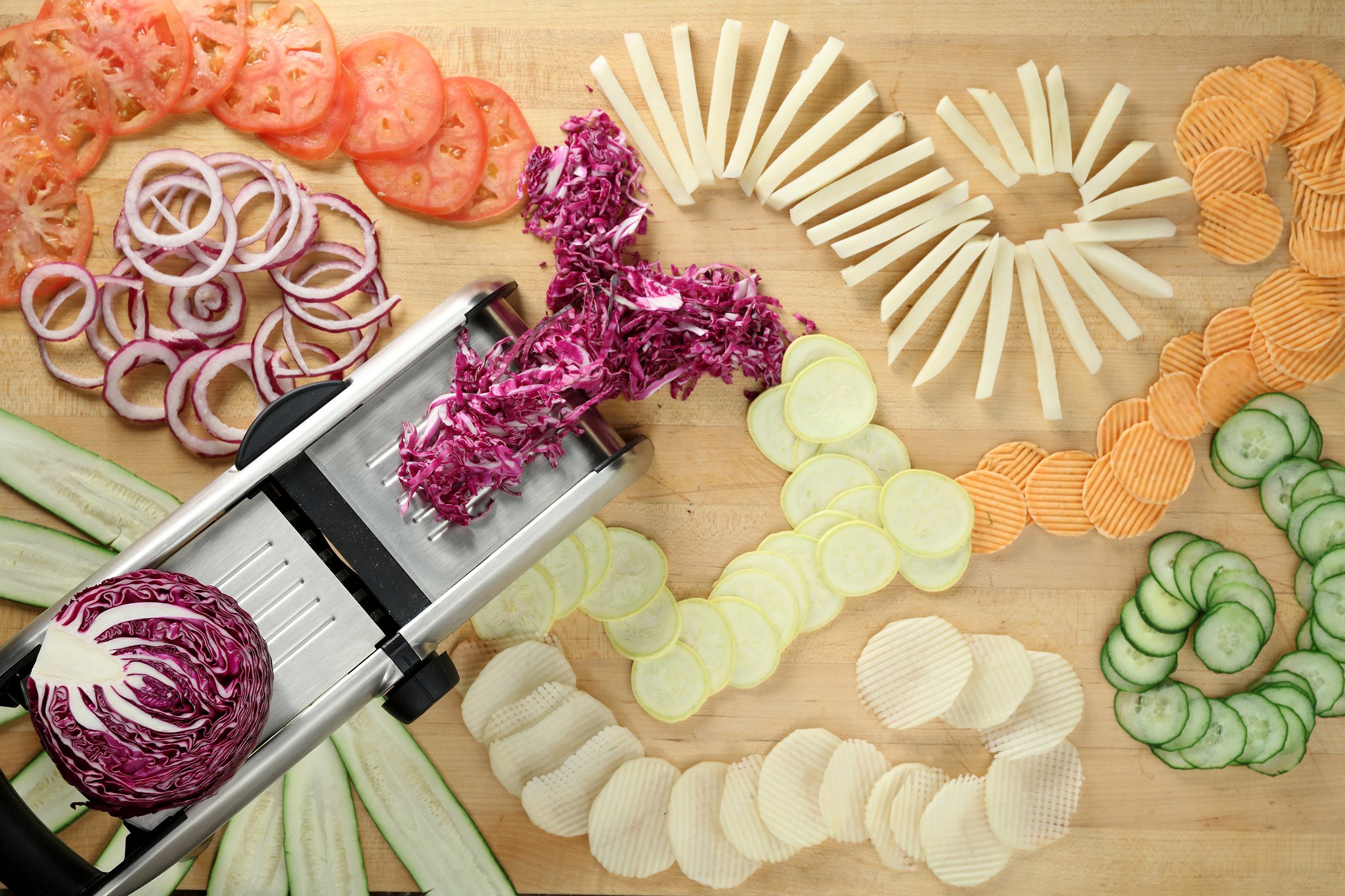 Mandolines make quick work of many tasks that normally are performed with a chef’s knife, including slicing french fries and veggie chips. MICHAEL TERCHA / CHICAGO TRIBUNE / TNS