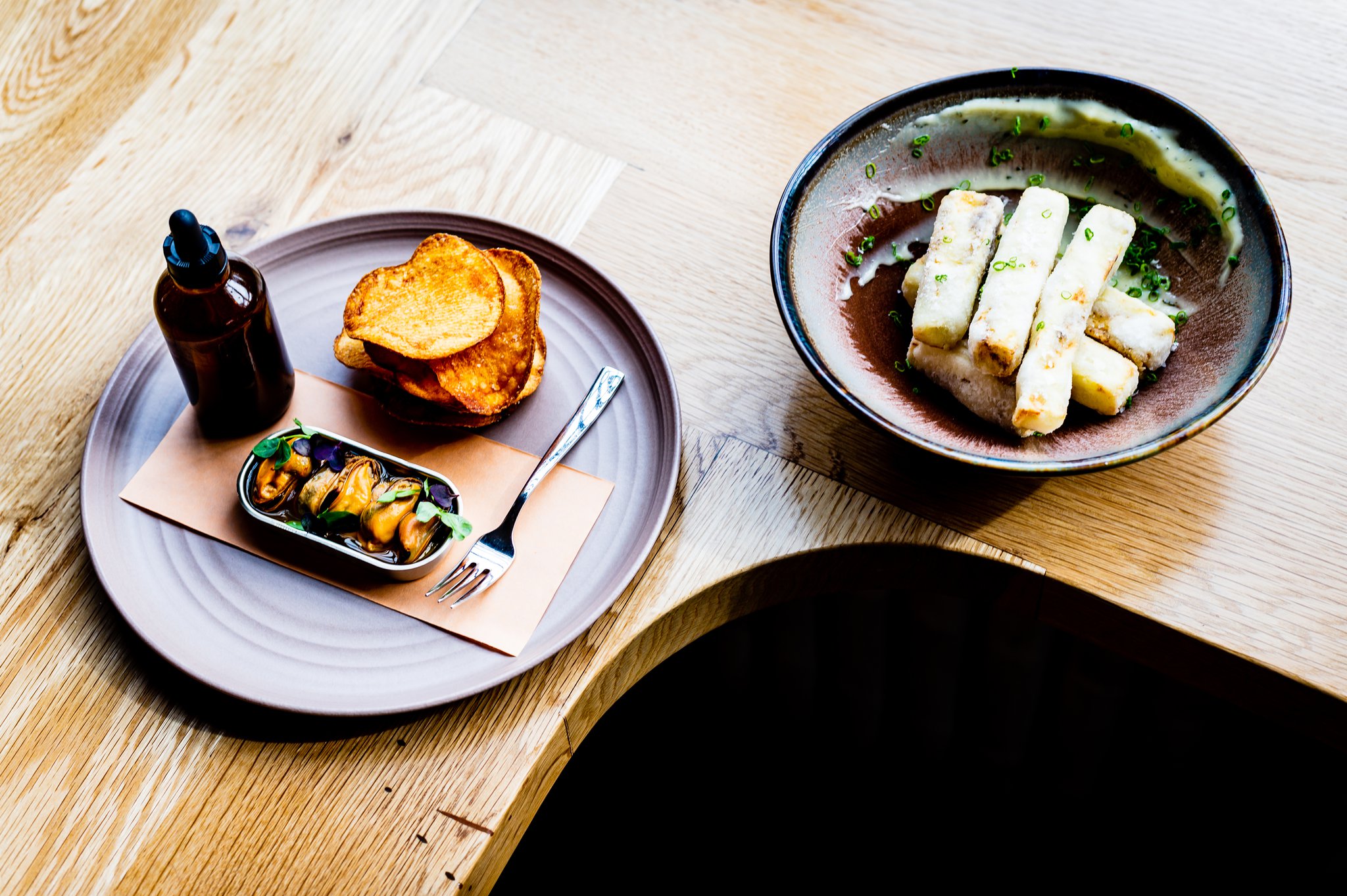 Chilled Mussels en Escabeche (left) and Crispy Eggplant are great ways to start a meal at Redbird.