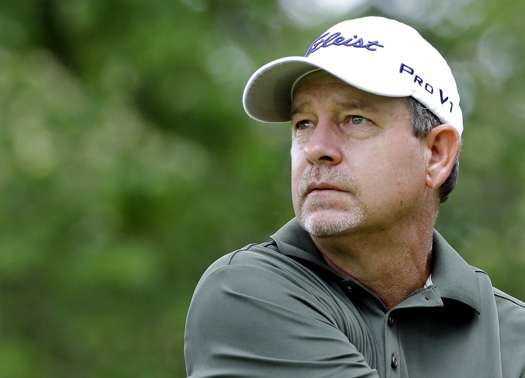 Bart Bryant watches his tee shot on the ninth hole during the second round of the Encompass Championship golf tournament in Glenview, Ill., June 21, 2014. (AP Photo/Nam Y. Huh, File)