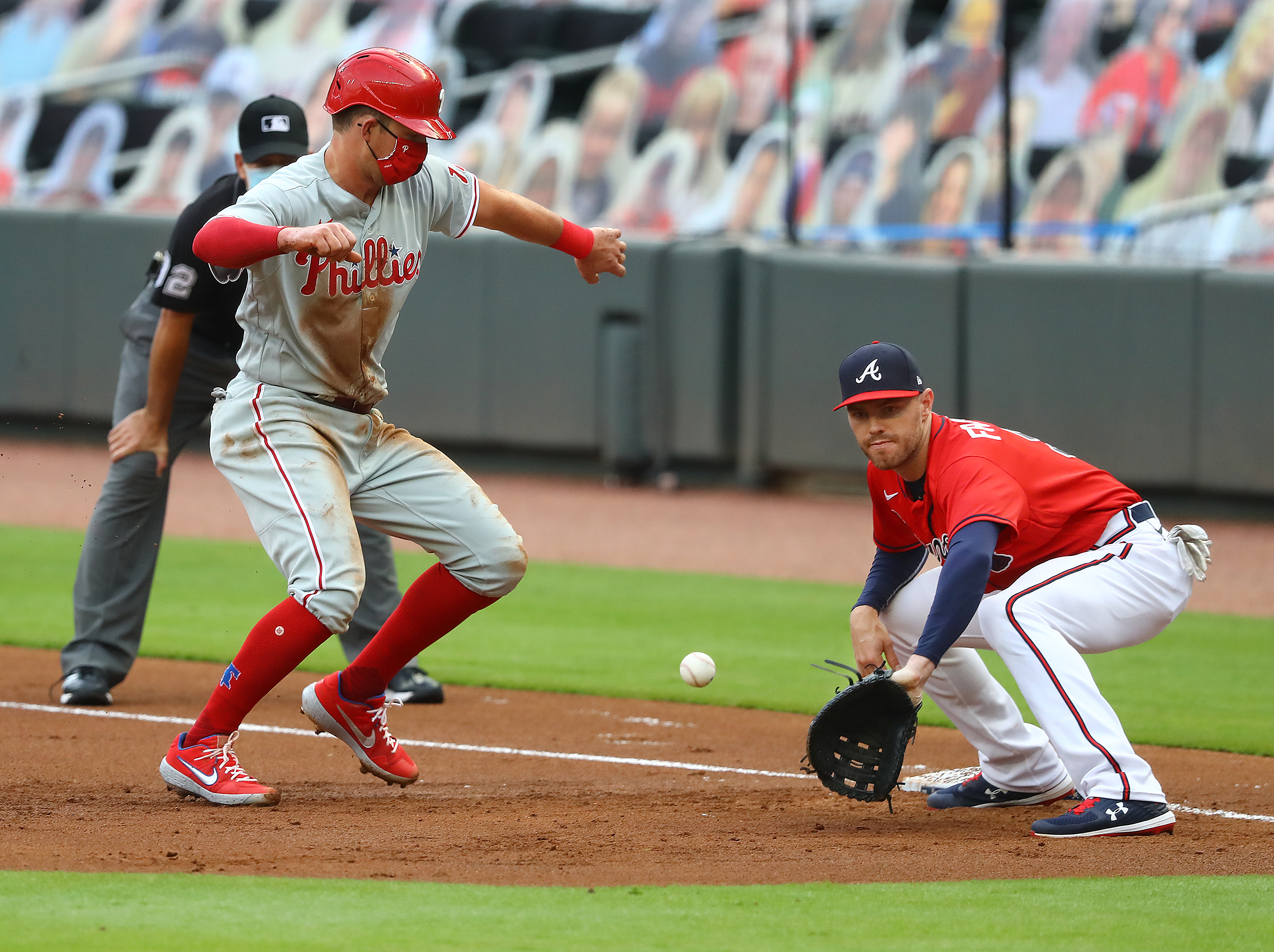 Andrew Knapp's tag of Dansby Swanson broke plate-blocking rules, Braves  manager Brian Snitker says