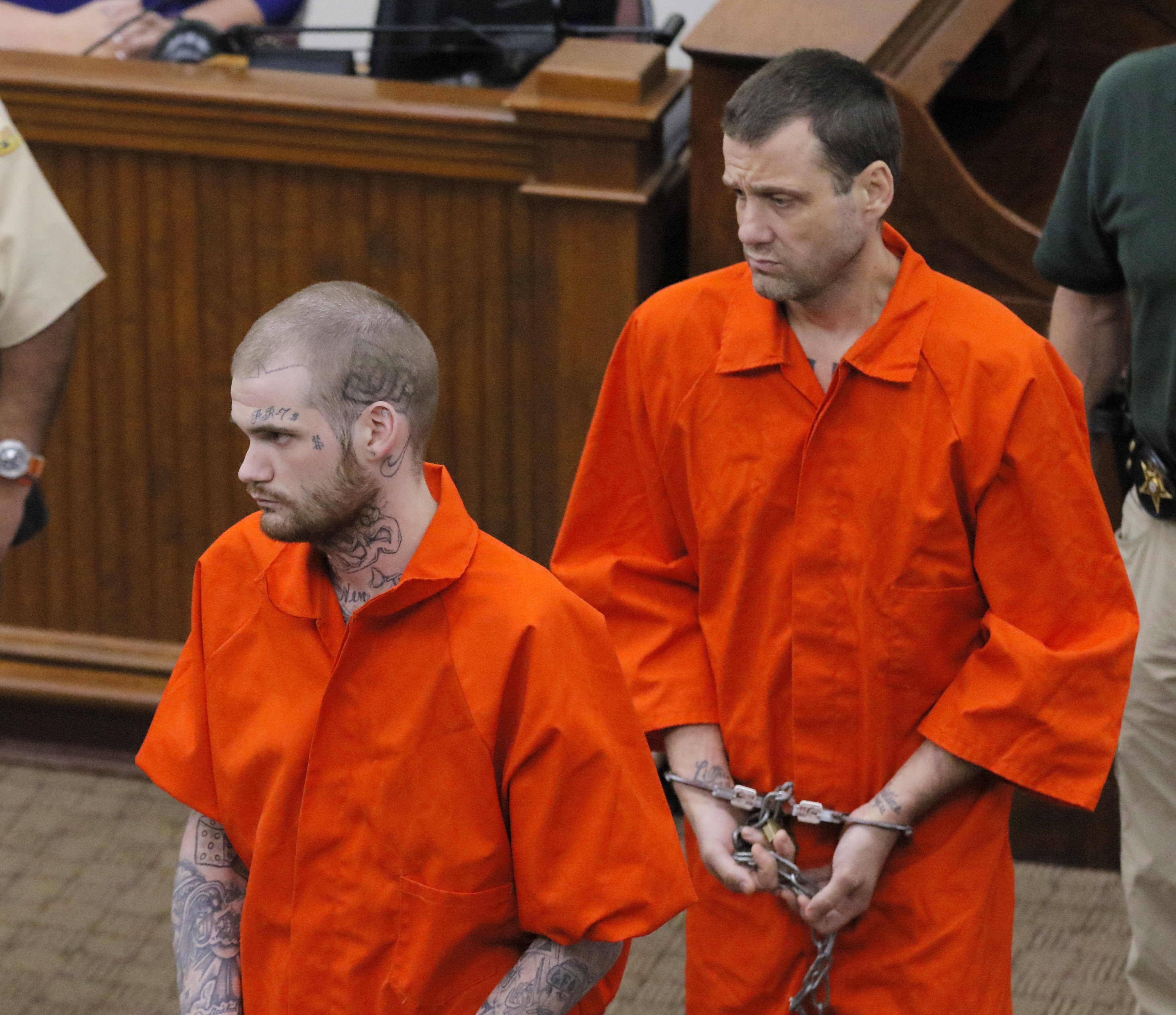 Eatonton, GA - Ricky Dubose (front) and Donnie Russsell Rowe enter the Putnam County courthouse last June for their first court apperance after they were re-captured. BOB ANDRES /BANDRES@AJC.COM
