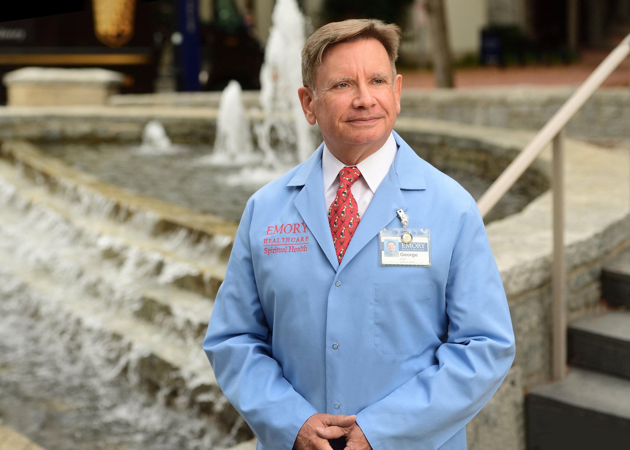 The Rev. George H. Grant wears the blue coat that signals he’s an Emory chaplain. He said the novel coronavirus has put more pressure on hospital staffers, and he’s there to help patients, their families and health care professionals.
