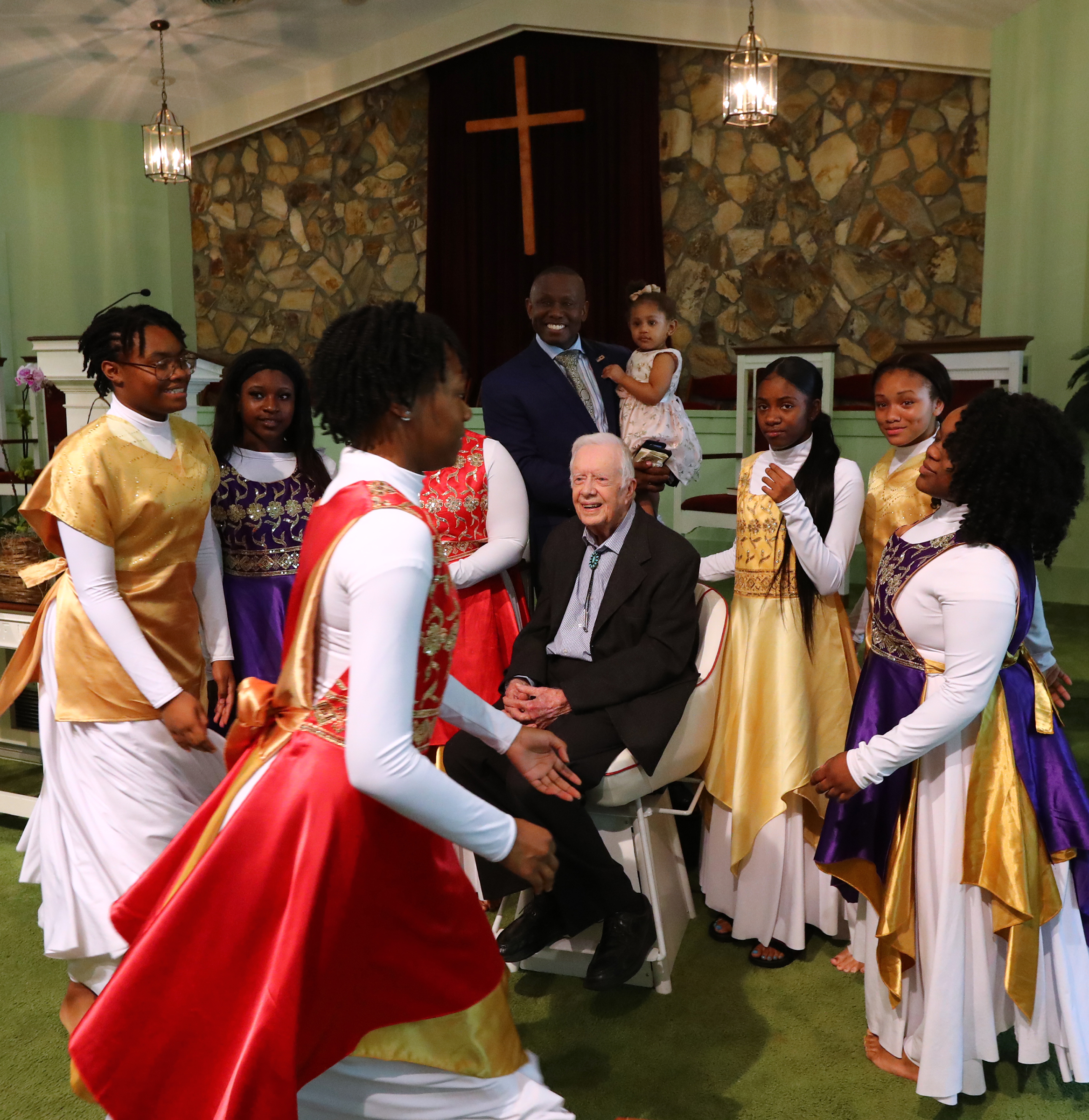 Former President Jimmy Carter has his picture taken with the Hayiya Dance Theatre Inc. after they performed during the worship service at Maranatha Baptist Church in Plains on Sunday, June 9, 2019, in Plains. The former president, 94, returned to teach Sunday school less than a month after falling and breaking his hip. (Photo: Curtis Compton/ccompton@ajc.com)