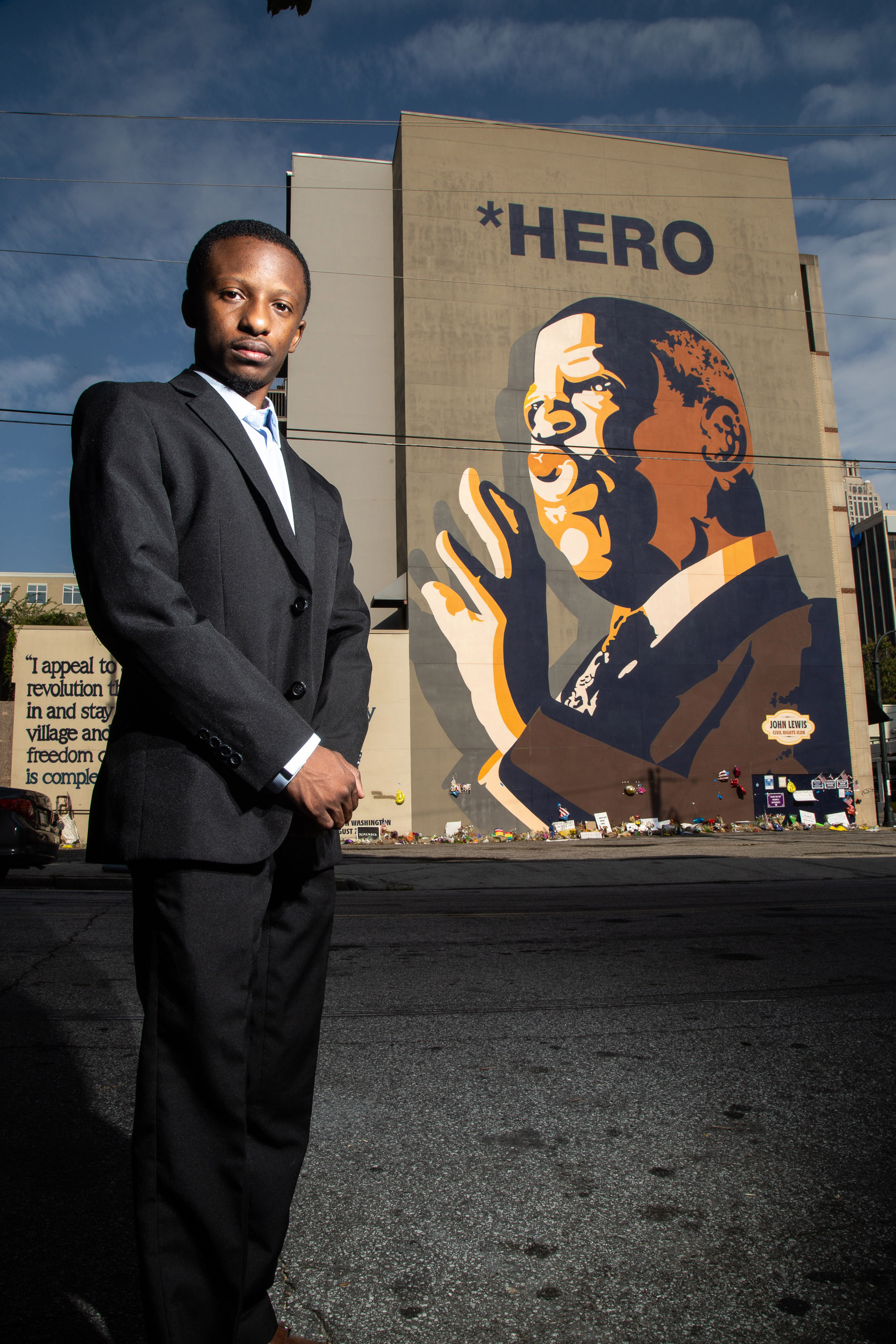 Jared Sawyer poses for a photograph in front of the John Lewis mural on Auburn Ave in Atlanta, August 6, 2020. STEVE SCHAEFER FOR THE ATLANTA JOURNAL-CONSTITUTION